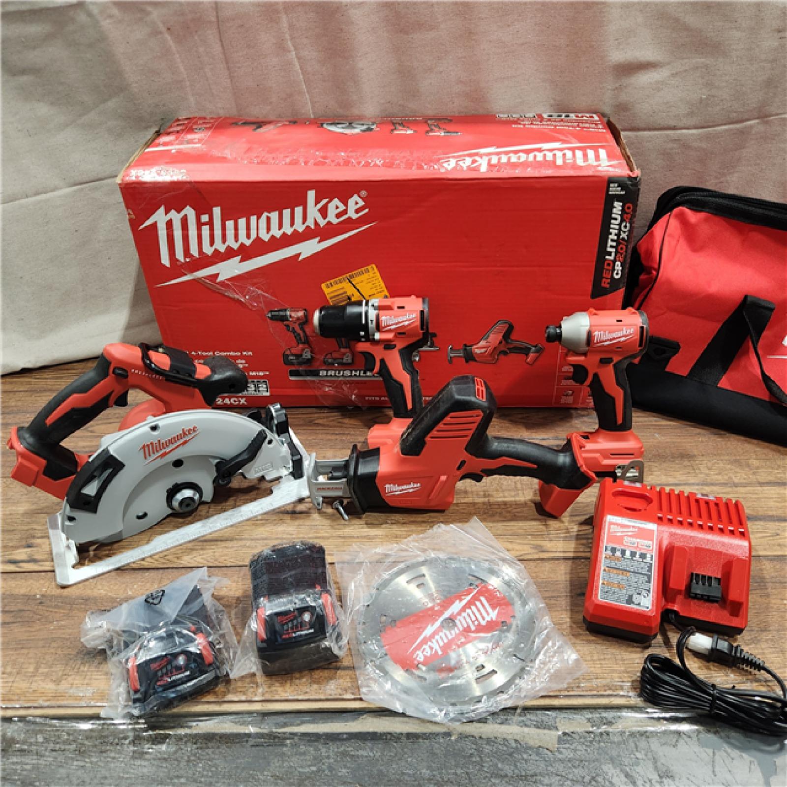 AS-IS Milwaukee M18 18-Volt Lithium-Ion Brushless Cordless Combo Kit (4-Tool) with 2-Batteries, 1-Charger and Tool Bag