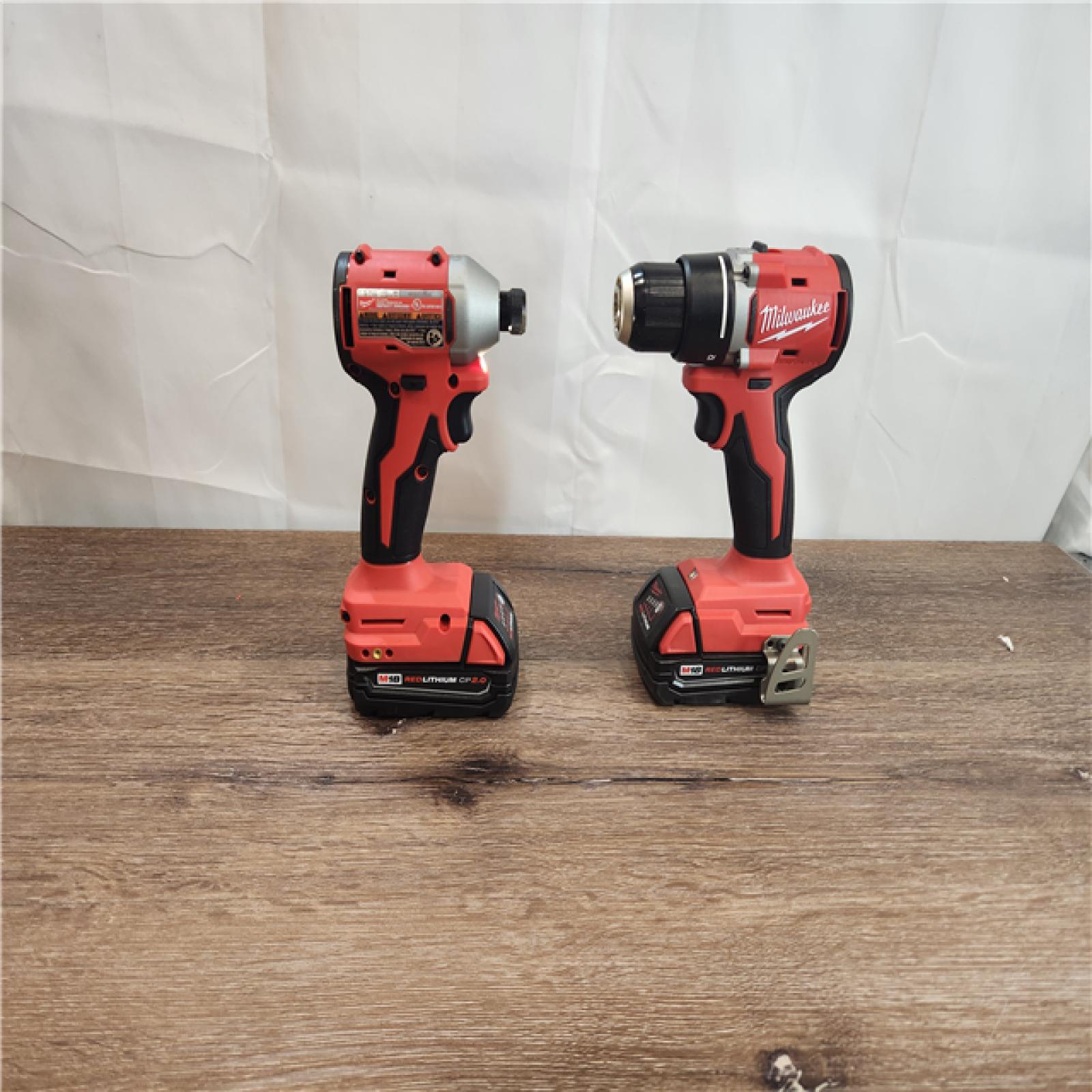 AS-IS Milwaukee 3692-22CT 18V M18 Lithium-Ion Compact Brushless Cordless 2-Tool Combo Kit with 1/2 Drill/Driver and 1/4 Hex Impact Driver 2.0 Ah