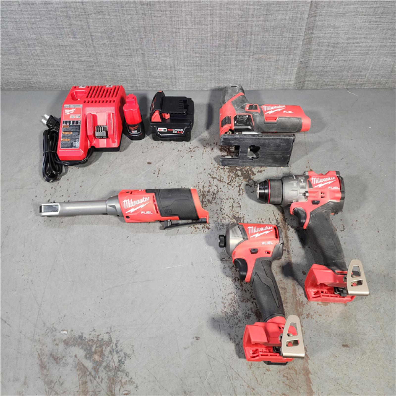 HOUSTON LOCATION - AS-IS MILWAUKEE 4 TOOL COMBO KIT W/ (2) BATTERY & CHARGER