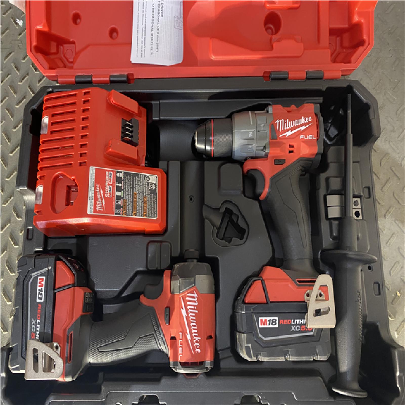 Houston location AS-IS Milwaukee 3697-22 M18 FUEL 1/2 Hammer Driller/Driver &1/4 Hex Impact Driver 2 Tool Combo Kit