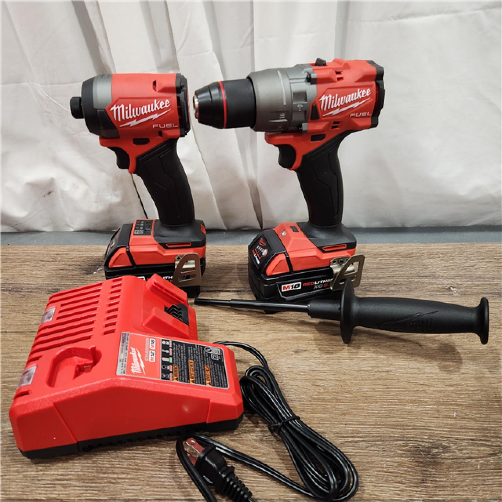 AS-IS Milwaukee M18 FUEL 18V Lithium-Ion Brushless Cordless Hammer Drill and Impact Driver Combo Kit (2-Tool) with 2 Batteries