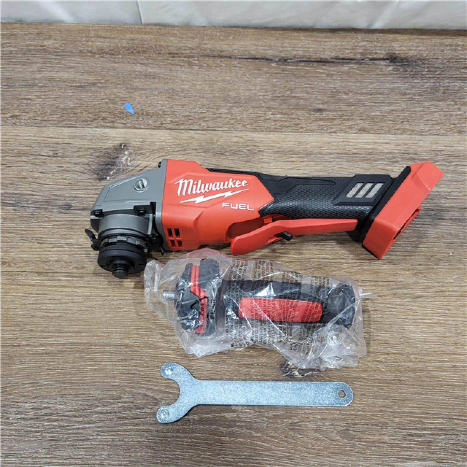 AS-IS Milwaukee 2880-20 M18 FUEL 18-Volt Lithium-Ion Brushless Cordless 4-1/2 in./5 in. Grinder W/Paddle Switch (Tool-Only)