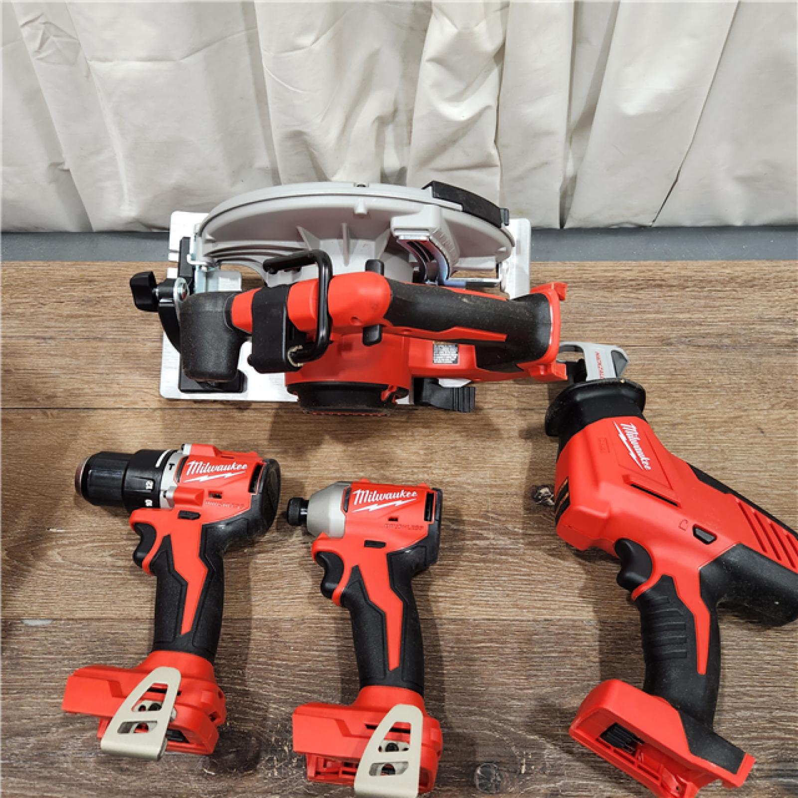 AS-IS Milwaukee M18 18-Volt Lithium-Ion Brushless Cordless Combo Kit (4-Tool) with 2-Batteries, 1-Charger and Tool Bag