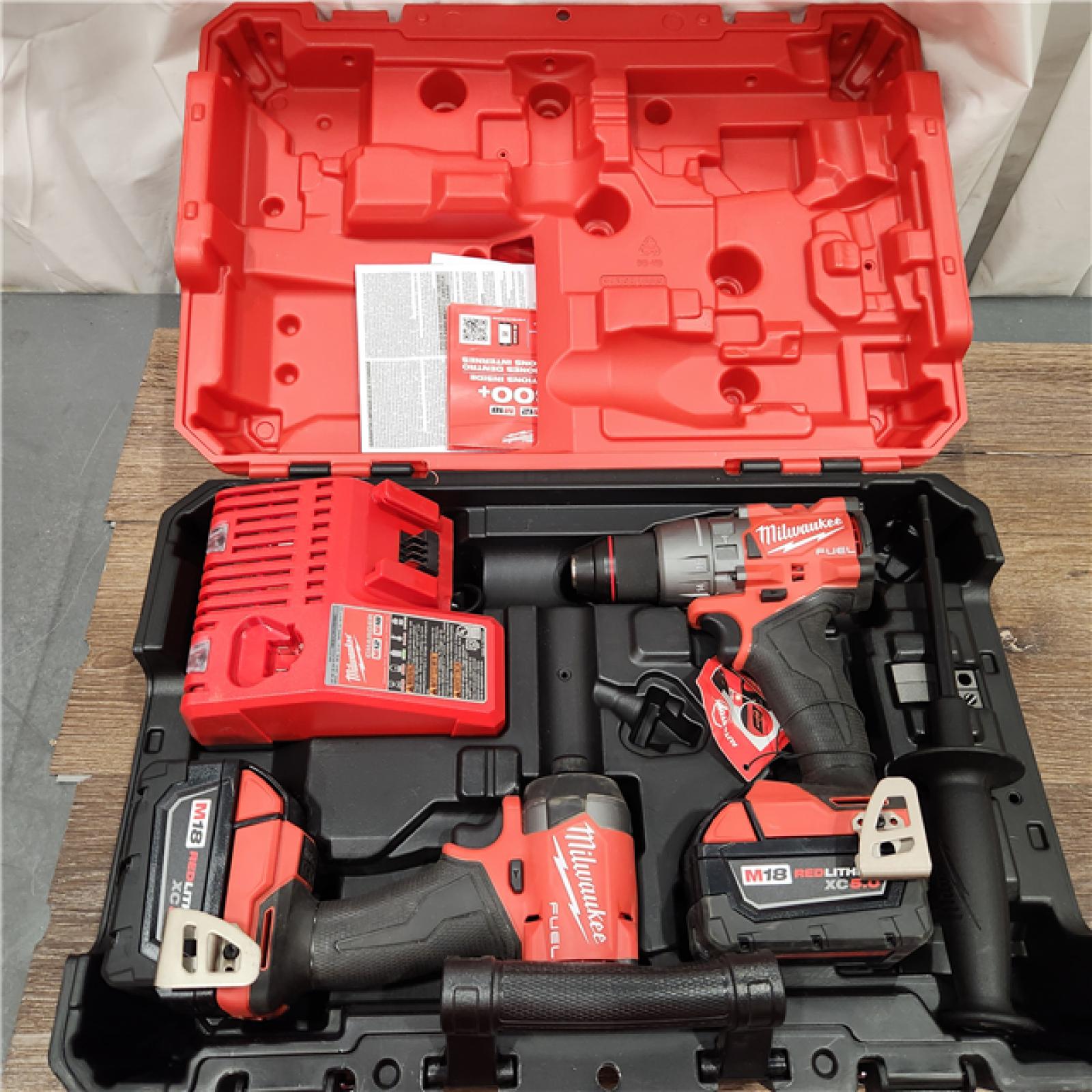 AS-IS Milwaukee M18 FUEL 18V Lithium-Ion Brushless Cordless Hammer Drill and Impact Driver Combo Kit (2-Tool) with 2 Batteries