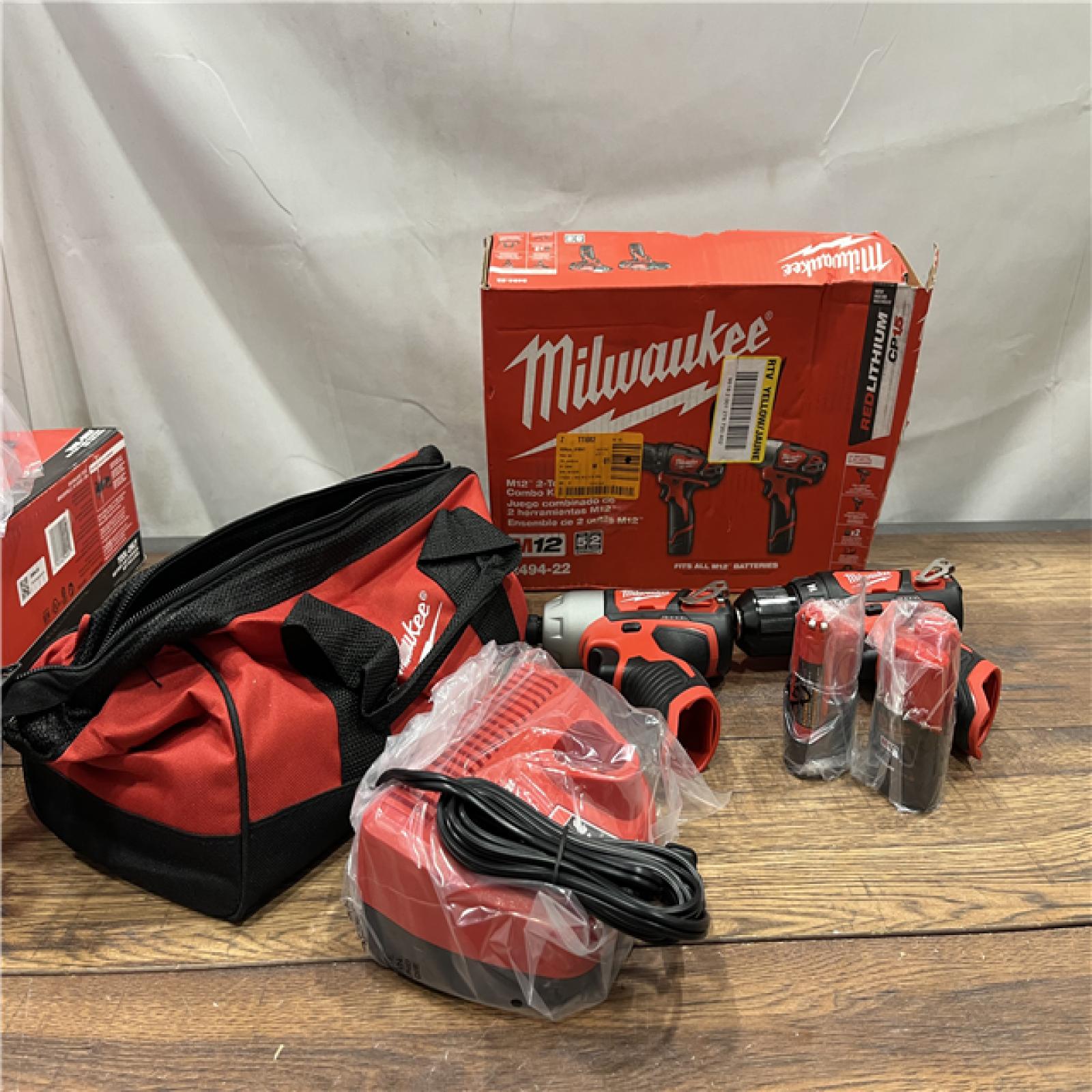 AS-IS MILWAUKEE M12 12V Lithium-Ion Cordless Drill Driver/Impact Driver Combo Kit with Two 1.5Ah Batteries, Charger and Bag (2-Tool)