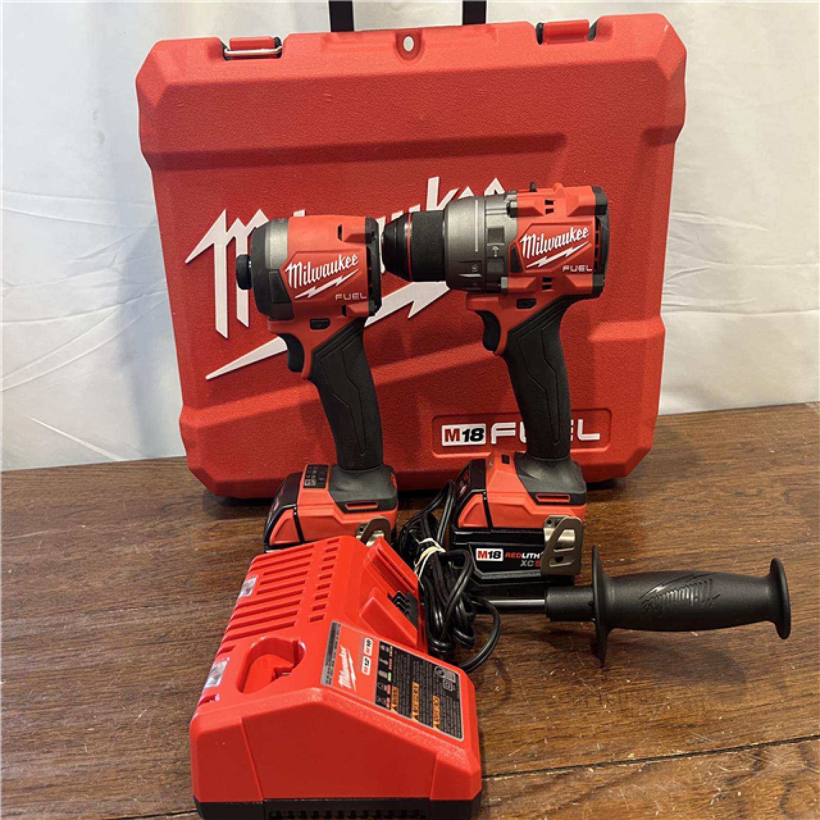 AS-ISMilwaukee M18 FUEL 18V Lithium-Ion Brushless Cordless Hammer Drill and Impact Driver Combo Kit (2-Tool) with 2 Batteries