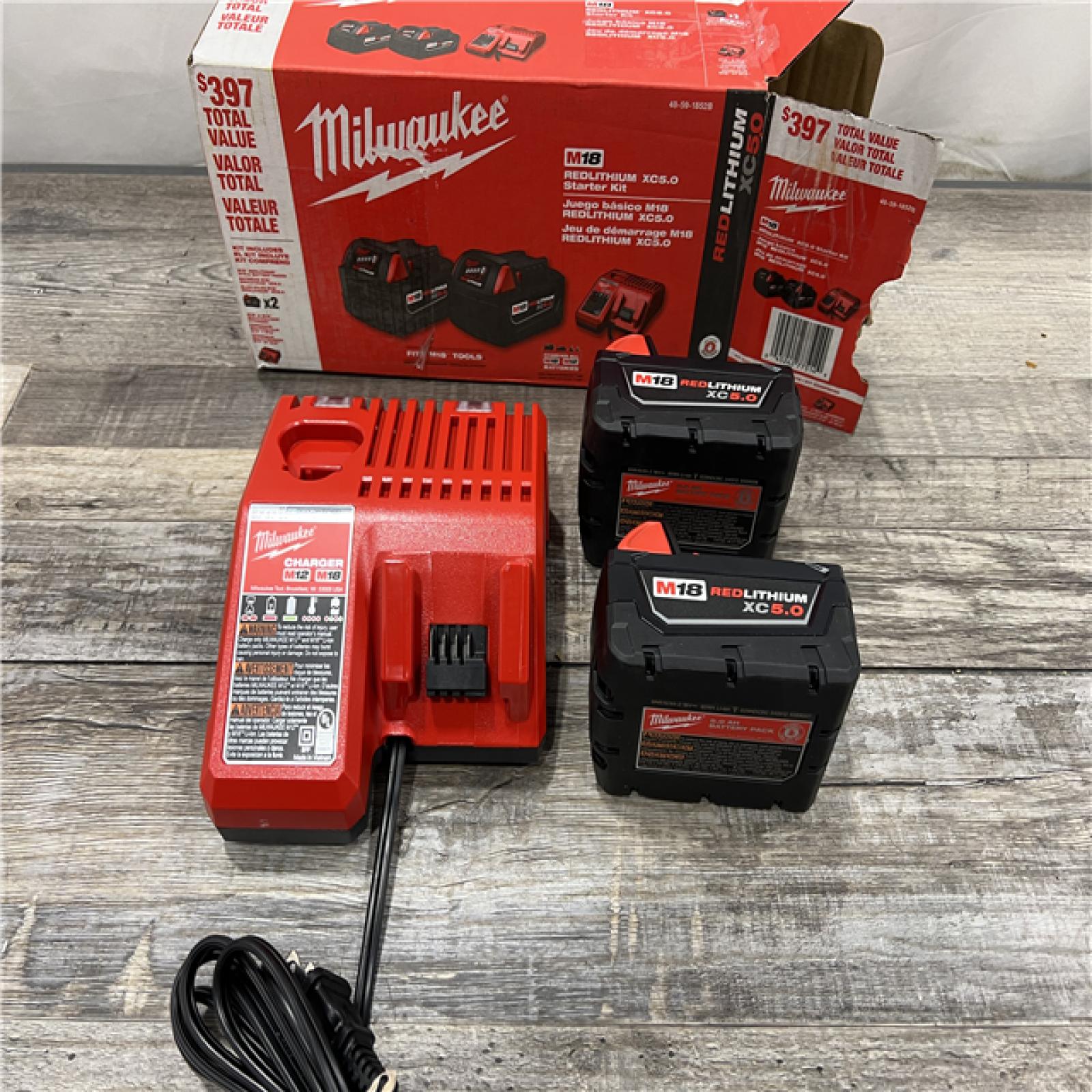 AS-IS Milwaukee M18 18-Volt Lithium-Ion XC Starter Kit with Two 5.0Ah Batteries / Charger (48-59-1852B)