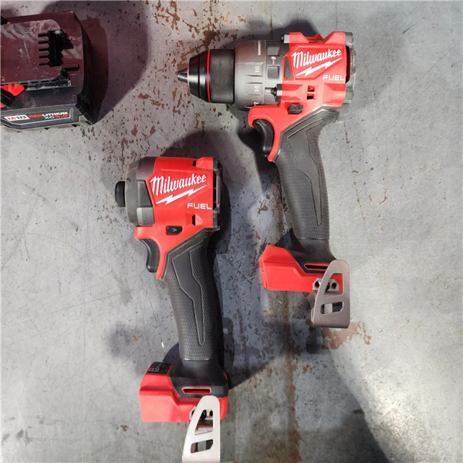 HOUSTON LOCATION - AS-IS Milwaukee M18 FUEL 18V Lithium-Ion Brushless Cordless Hammer Drill and Impact Driver Combo Kit (2-Tool) with 2 Batteries