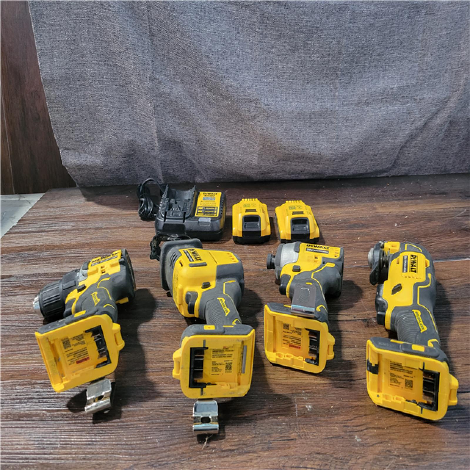 California As-Is Dewalt Brushless 4-Tool Combo Kit (Battery,Charger, and Tool Bag Included)