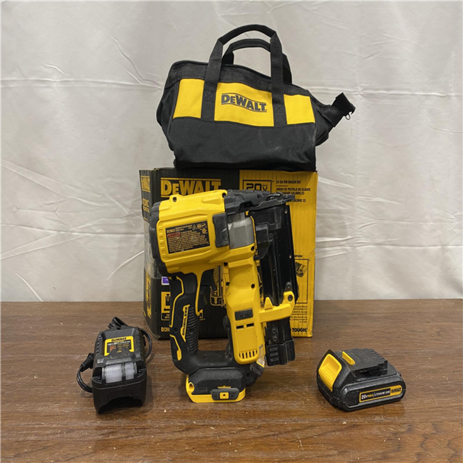 AS-IS DEWALT ATOMIC 20V MAX Lithium Ion Cordless 23 Gauge Pin Nailer Kit with 3.0Ah Battery and Charger