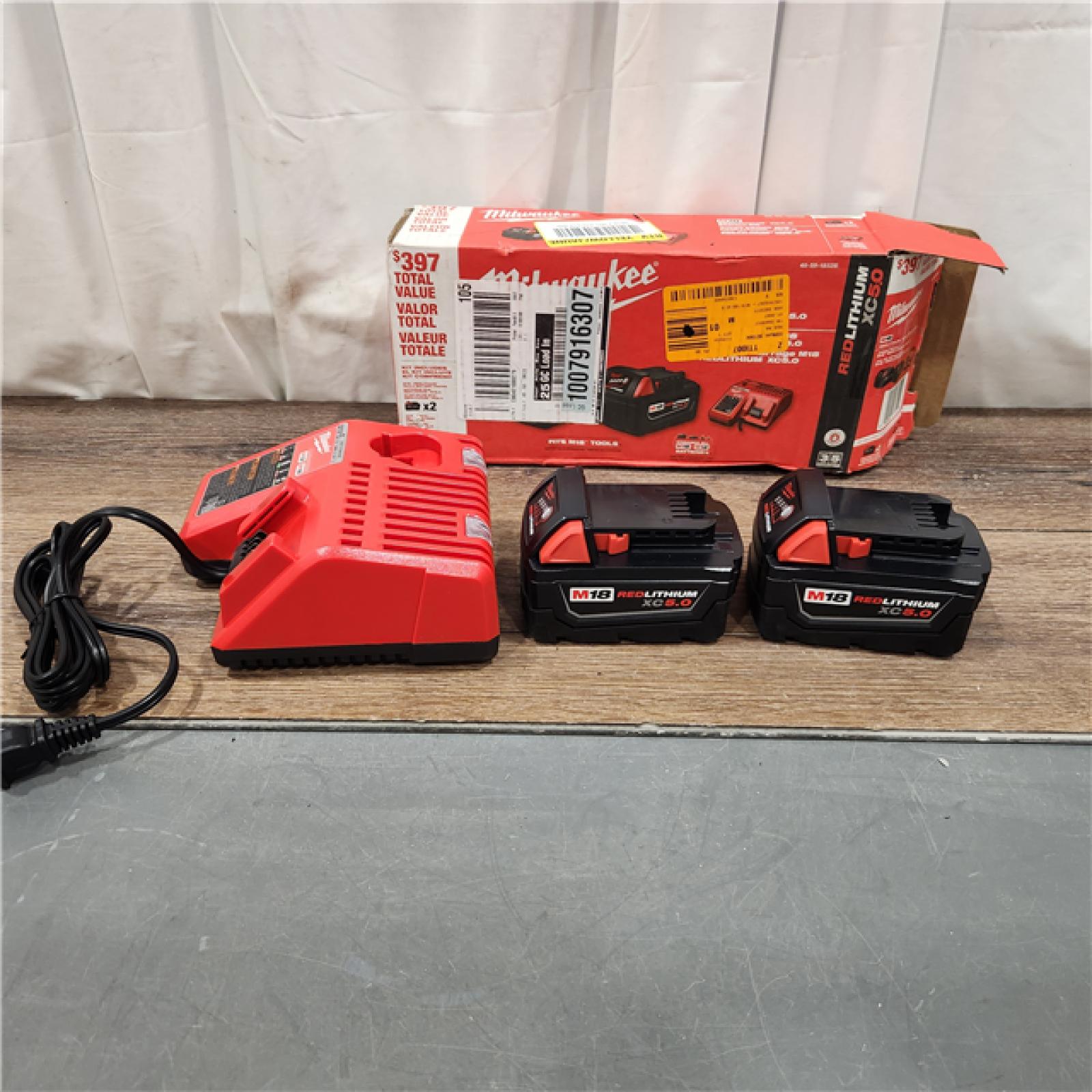 AS IS M18 18-Volt Lithium-Ion XC Starter Kit with Two 5.0Ah Batteries and Charger