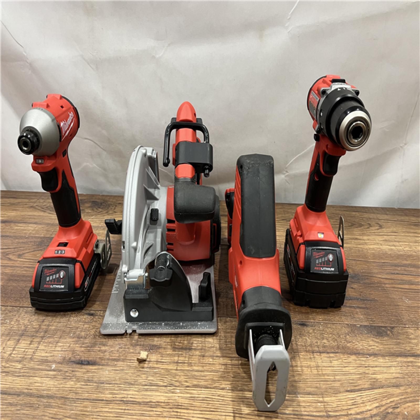 AS IS Milwaukee M18 18-Volt Lithium-Ion Brushless Cordless Combo Kit (4-Tool) with 2-Batteries, 1-Charger and Tool Bag