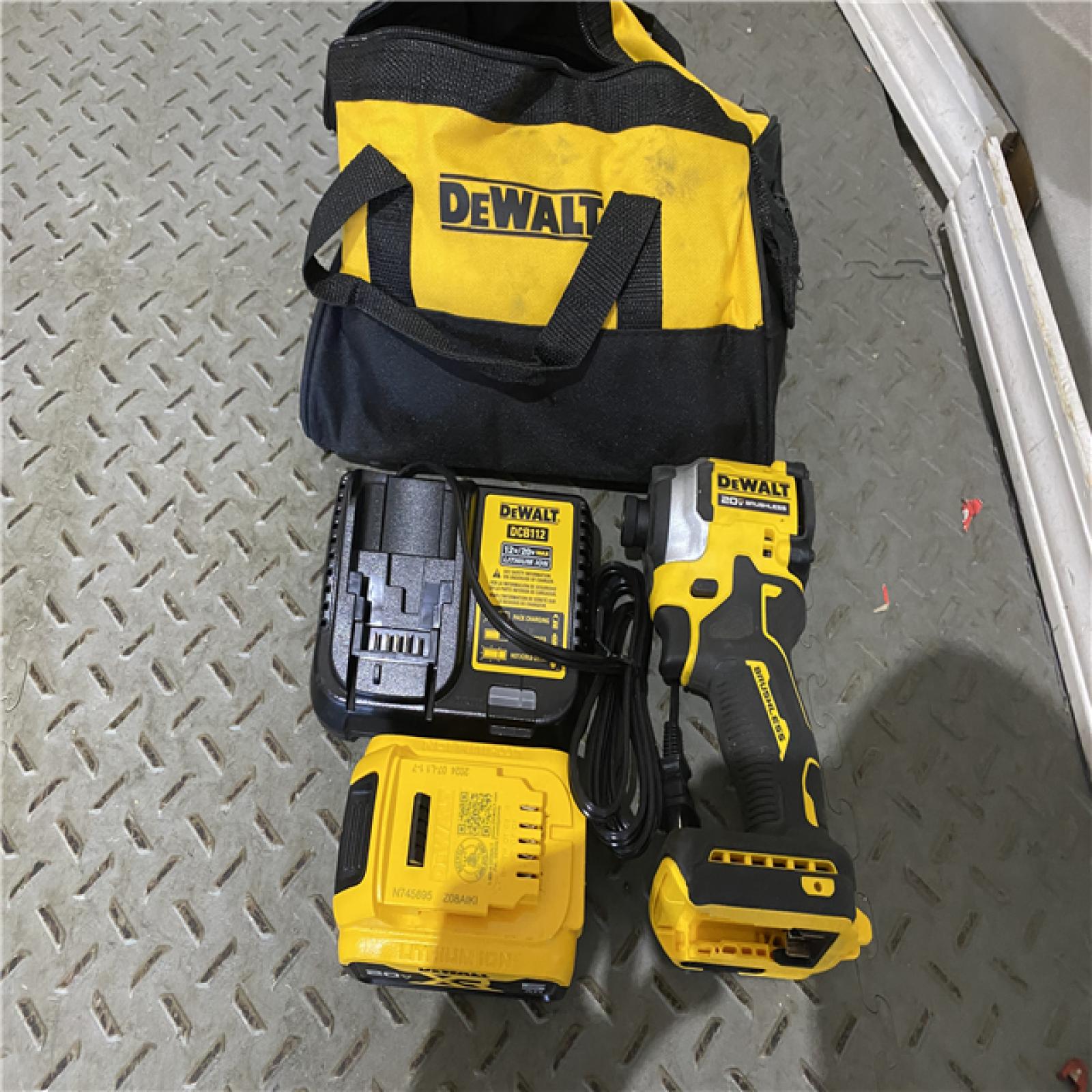 Houston location AS-IS DEWALT ATOMIC 20V MAX Lithium-Ion Cordless 1/4 in. Brushless Impact Driver Kit, 5 Ah Battery, Charger, and Bag