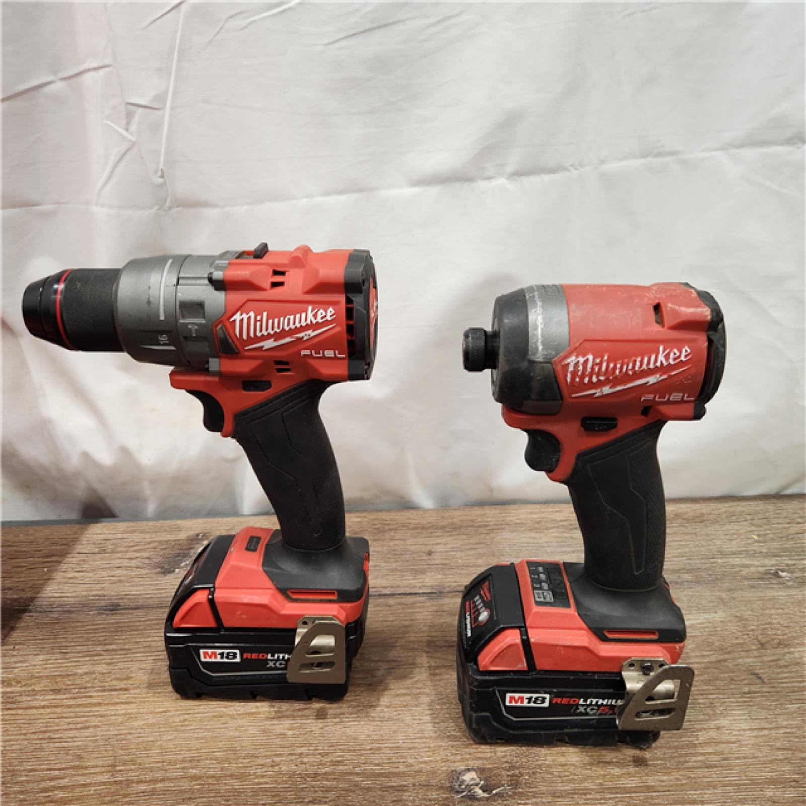 AS-IS Milwaukee M18 FUEL 18V Lithium-Ion Brushless Cordless Hammer Drill and Impact Driver Combo Kit (2-Tool) with 2 Batteries