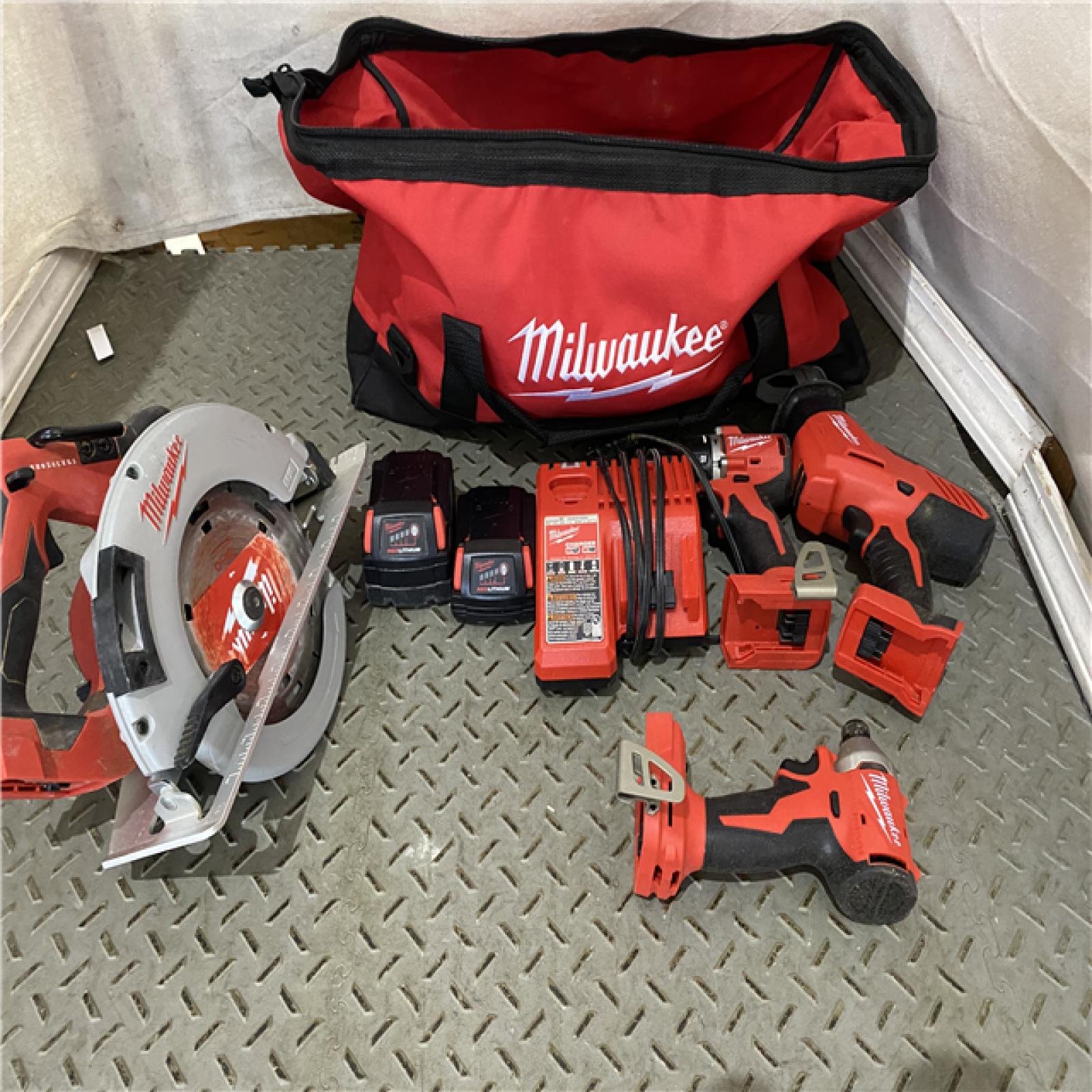 Houston location AS-IS M18 18-Volt Lithium-Ion Brushless Cordless Combo Kit (4-Tool) with 2-Batteries, 1-Charger and Tool Bag