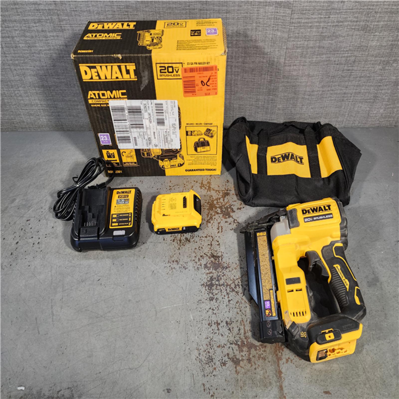 HOUSTON LOCATION - AS-IS DEWALT ATOMIC 20V MAX Lithium Ion Cordless 23 Gauge Pin Nailer Kit with 2.0Ah Battery and Charger