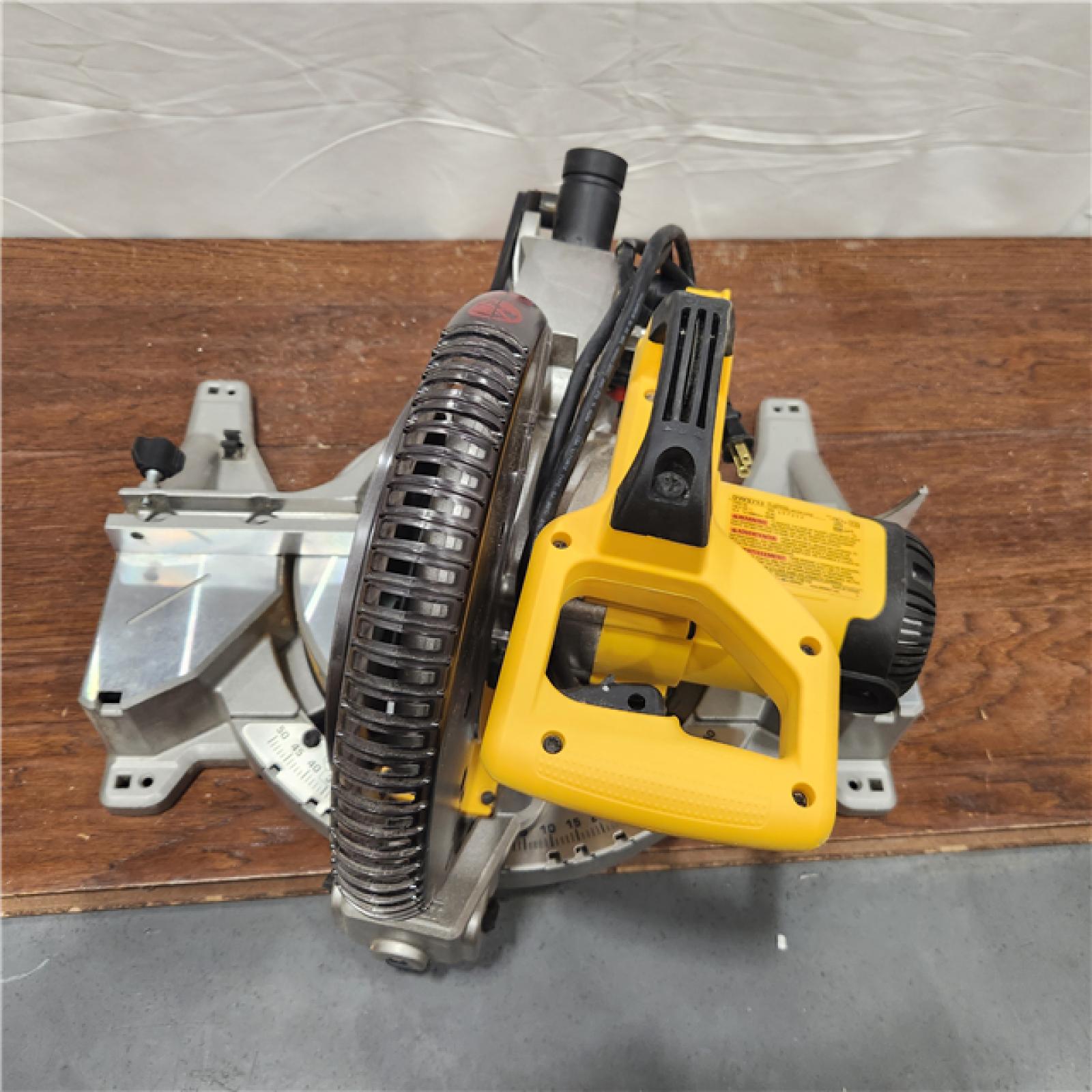 AS-IS DEWALT 15 Amp Corded 12 in. Double Bevel Sliding Compound Miter Saw with XPS Technology, Blade Wrench and Material Clamp