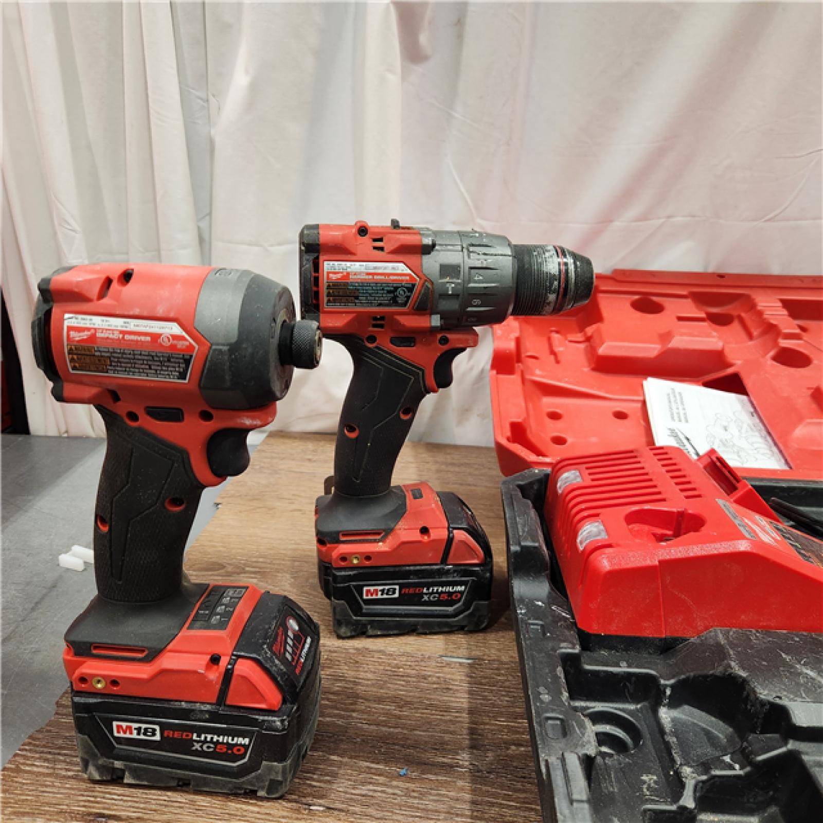 AS-IS Milwaukee M18 FUEL 18V Lithium-Ion Brushless Cordless Hammer Drill and Impact Driver Combo Kit (2-Tool) with 2 Batteries