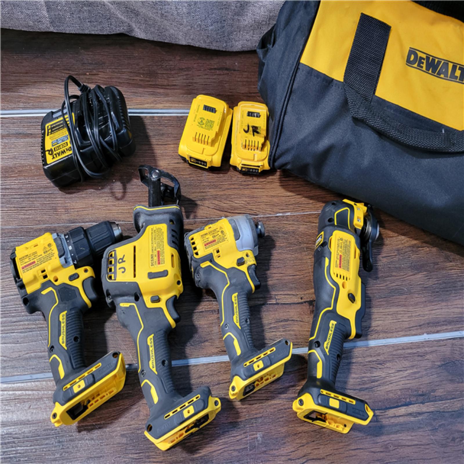 California As-Is Dewalt Brushless 4-Tool Combo Kit (Battery,Charger, and Tool Bag Included)