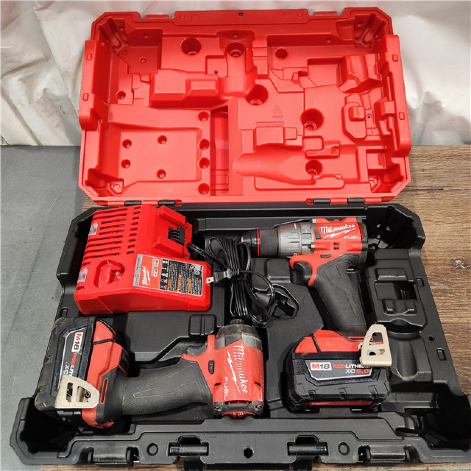 AS-IS Milwaukee M18 FUEL 18V Lithium-Ion Brushless Cordless Hammer Drill and Impact Driver Combo Kit (2-Tool) with 2 Batteries