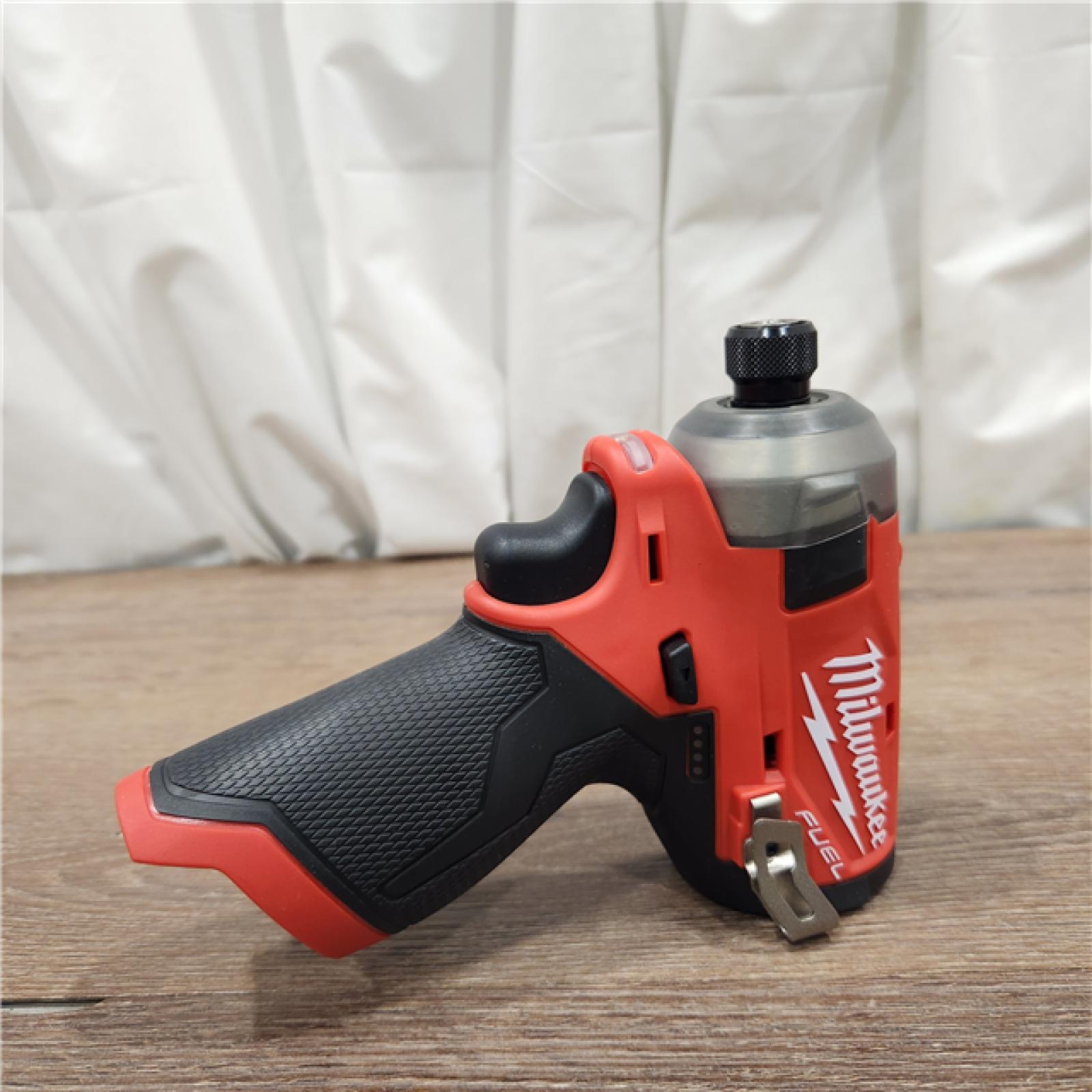 AS-IS Milwaukee M12 FUEL 12-Volt Lithium-Ion Brushless Cordless Stubby 1/4 in. Impact Wrench Kit with One 4.0 and One 2.0Ah Batteries