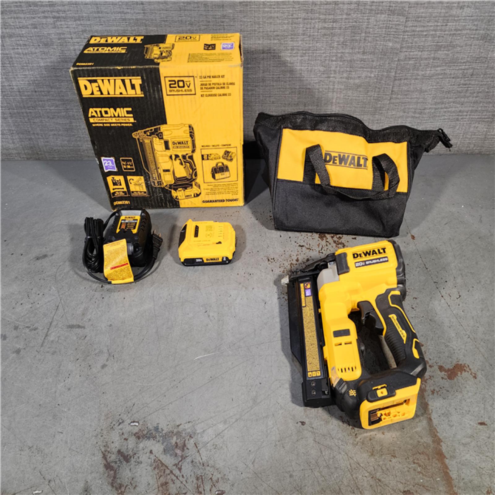 HOUSTON LOCATION - AS-IS DEWALT ATOMIC 20V MAX Lithium Ion Cordless 23 Gauge Pin Nailer Kit with 2.0Ah Battery and Charger