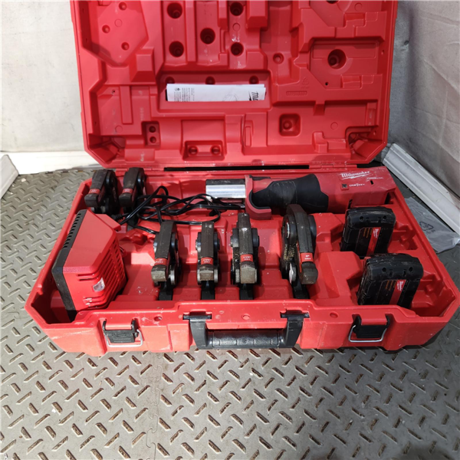 Houston location AS-IS MILWAUKEE M18 18-Volt Lithium-Ion Brushless Cordless FORCE LOGIC Press Tool Kit with 1/2 in. - 2 in. Jaws Kit (6-Jaws Included)