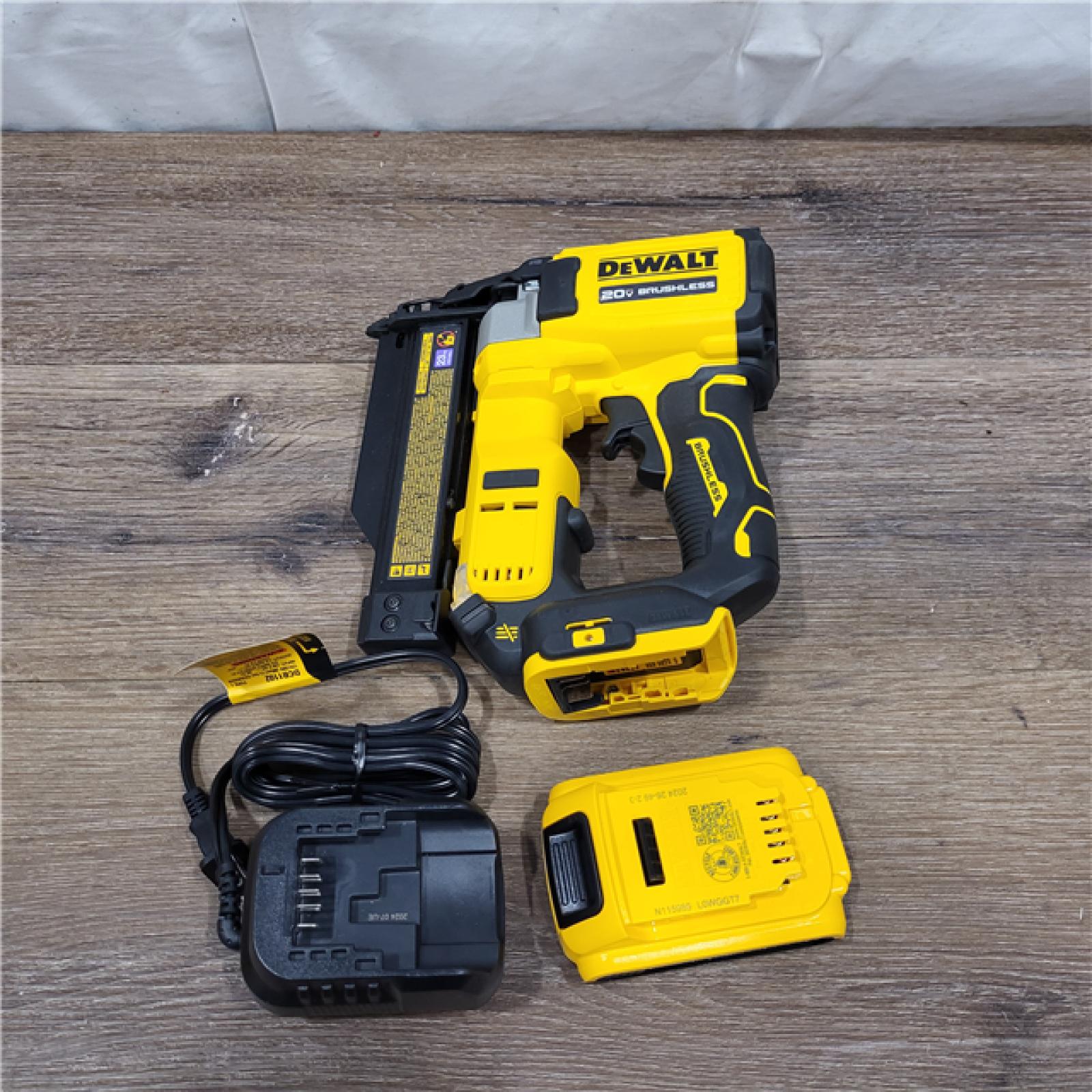 AS-IS DEWALT ATOMIC 20V MAX Lithium Ion Cordless 23 Gauge Pin Nailer Kit with 2.0Ah Battery and Charger