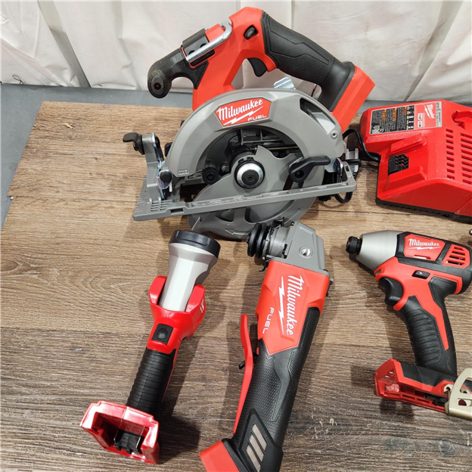 AS-IS M18 18-Volt Lithium-Ion Brushless Cordless FUEL Combo Kit (5-Tool) with 2-Batteries, 1-Charger, and Tool Bag