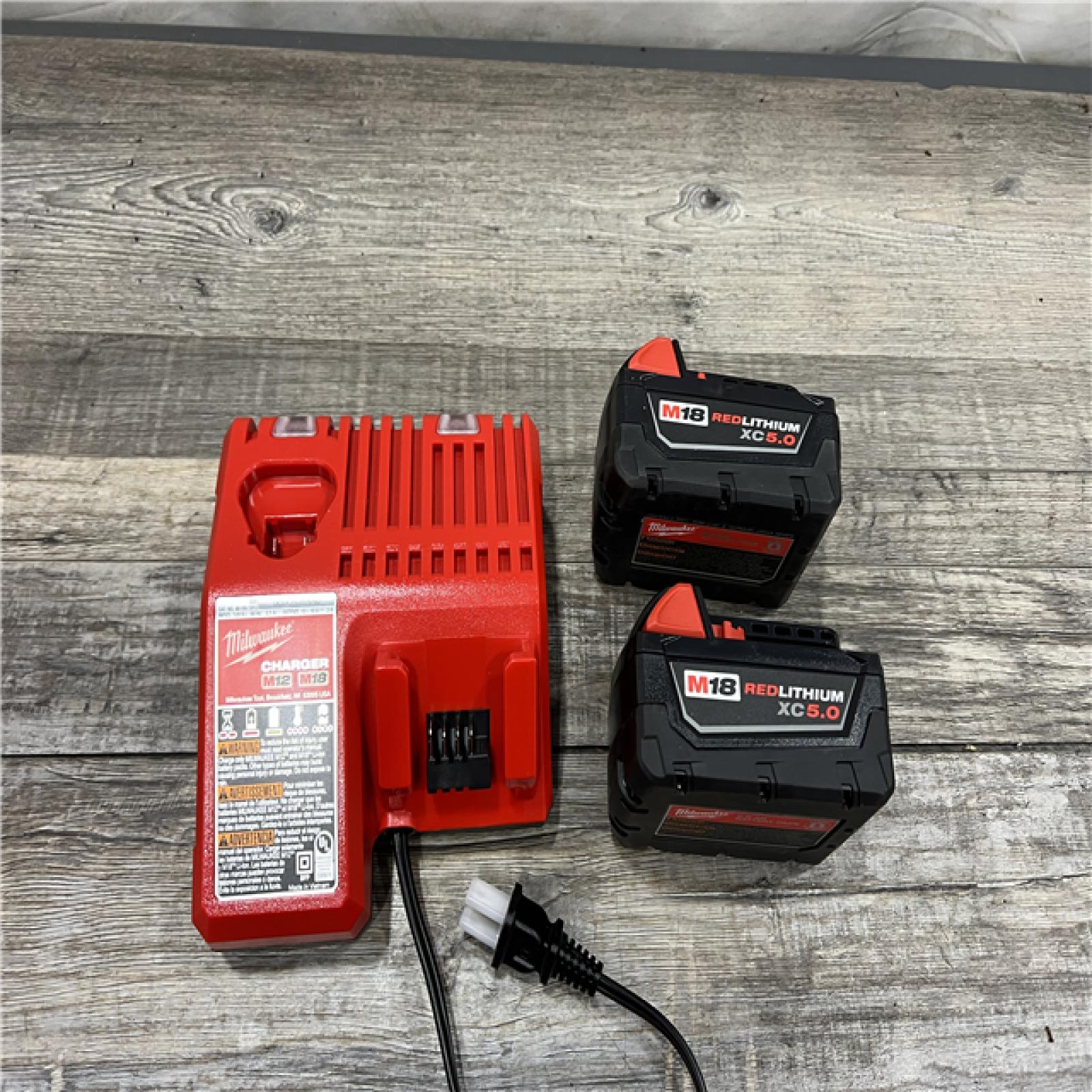 AS-IS MILWAUKEE M18 18-Volt Lithium-Ion XC Starter Kit with Two 5.0Ah Batteries and Charger