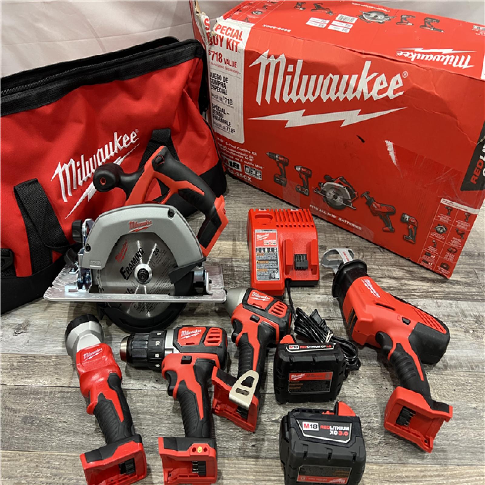 AS-IS Milwaukee M18 18-Volt Lithium-Ion Cordless Combo Tool Kit (5-Tool) with (1) 3.0Ah and (1) 1.5Ah Battery, (1) Charger, (1) Tool Bag