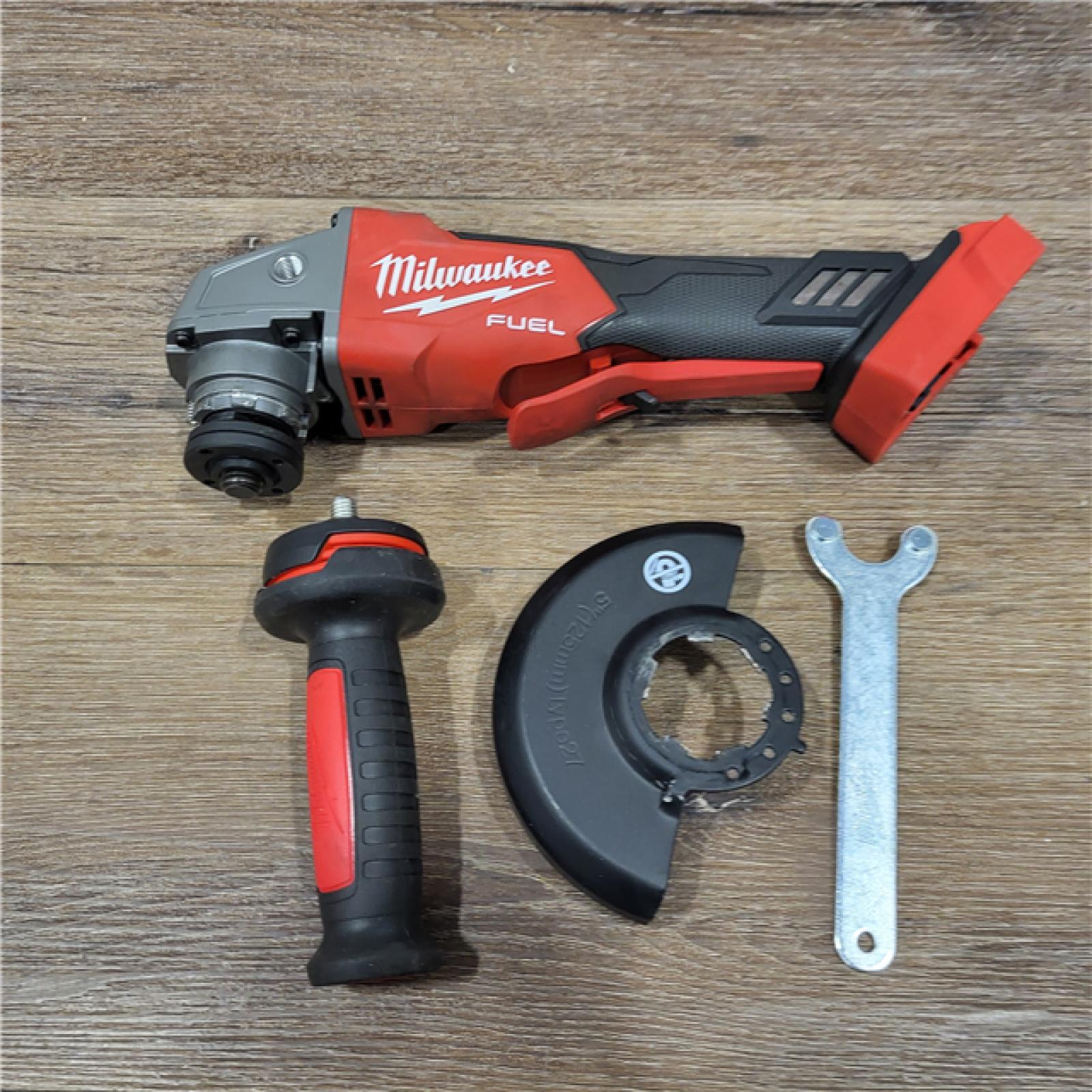 AS-IS Milwaukee 2880-20 M18 FUEL 18-Volt Lithium-Ion Brushless Cordless 4-1/2 in./5 in. Grinder W/Paddle Switch (Tool-Only)