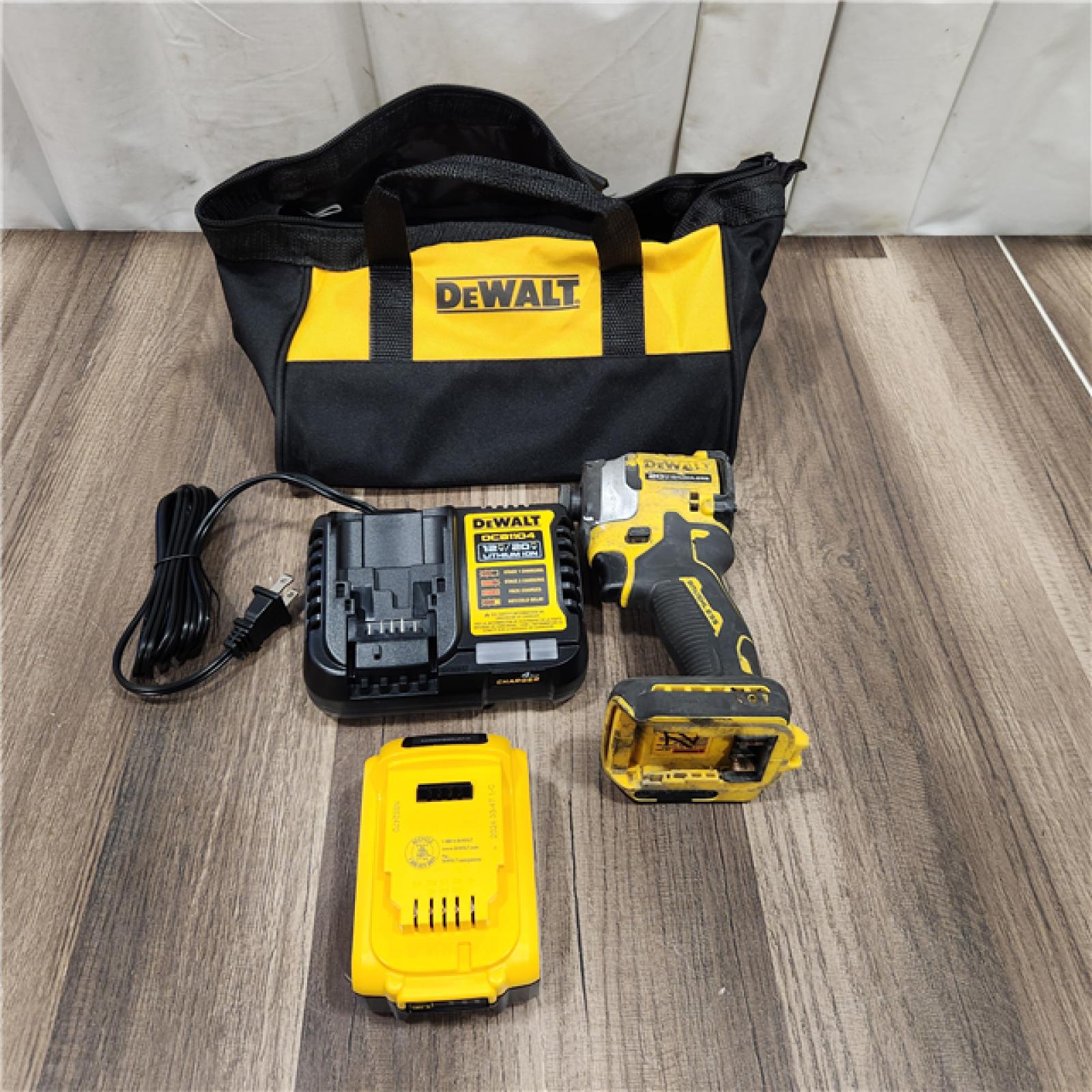 AS IS DEWALT ATOMIC 20V MAX Lithium-Ion Cordless 1/4 in. Brushless Impact Driver Kit, 5 Ah Battery, Charger, and Bag