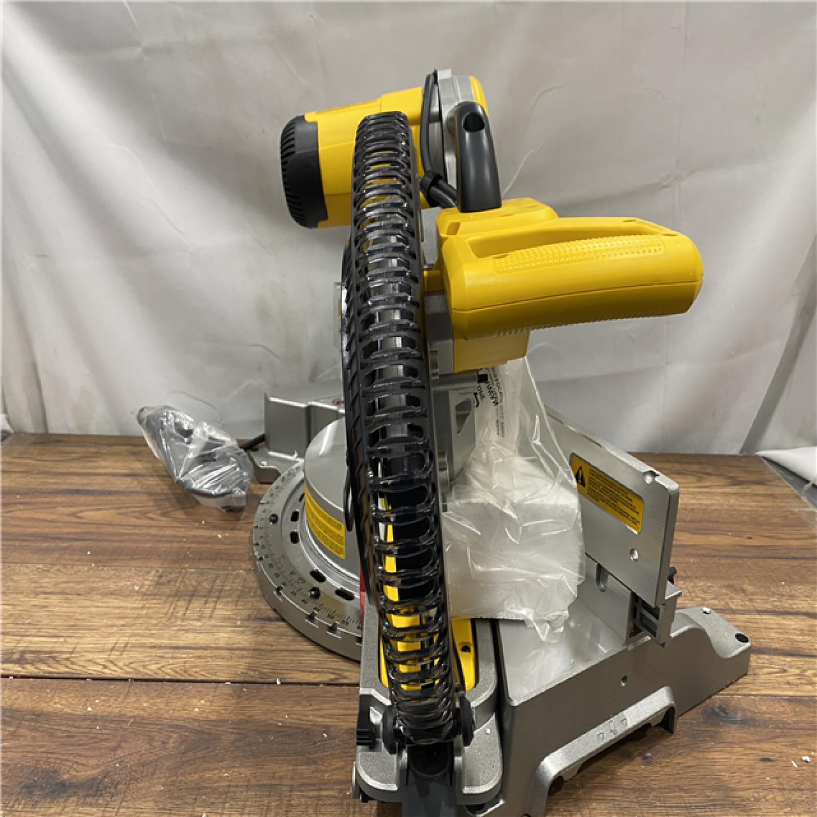 AS IS DEWALT 15 Amp Corded 12 in. Double Bevel Sliding Compound Miter Saw, Blade Wrench and Material Clamp