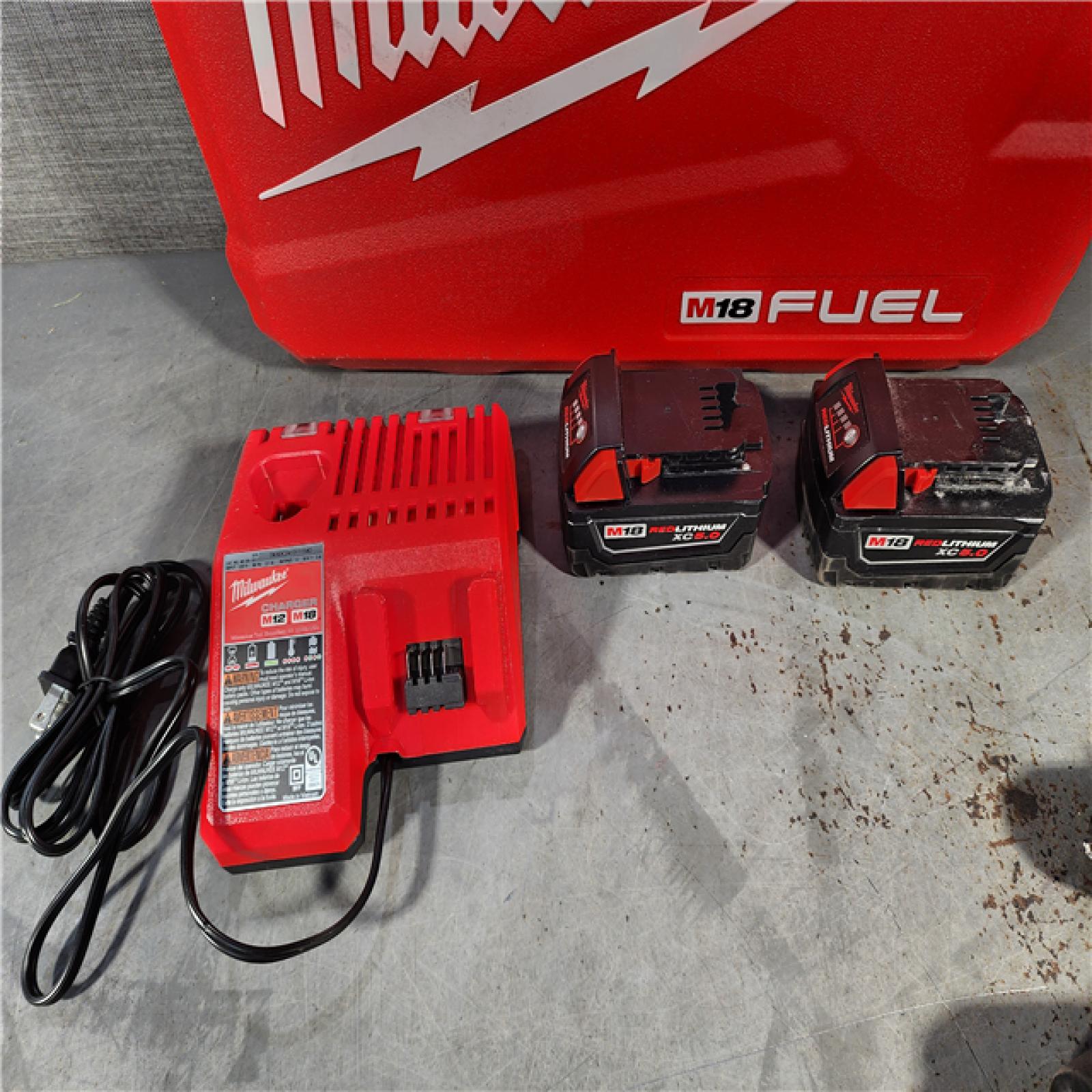 HOUSTON LOCATION - AS-IS Milwaukee M18 FUEL 18V Lithium-Ion Brushless Cordless Hammer Drill and Impact Driver Combo Kit (2-Tool) with 2 Batteries