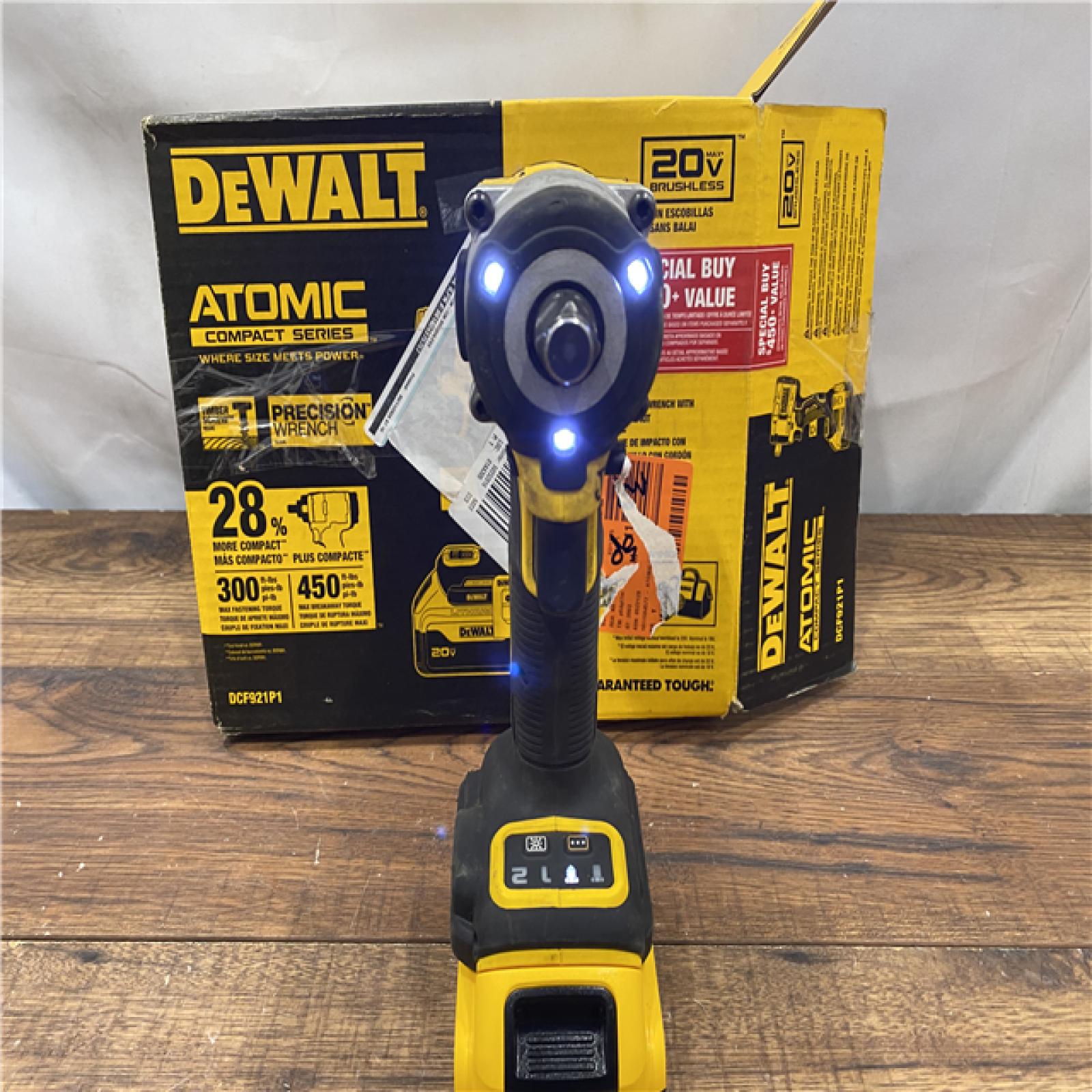 AS IS DEWALT ATOMIC 20V MAX Lithium-Ion Brushless Cordless 1/2 in. Variable Speed Impact Wrench Kit with 5 Ah Battery and Charger