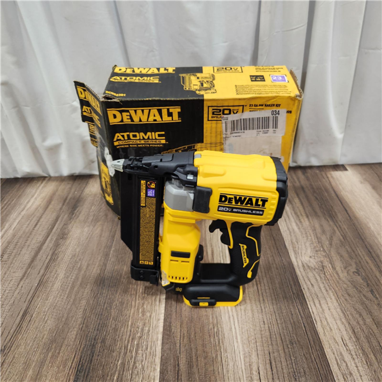 AS IS DEWALT ATOMIC 20V MAX Lithium Ion Cordless 23 Gauge Pin Nailer Kit with 3.0Ah Battery and Charger