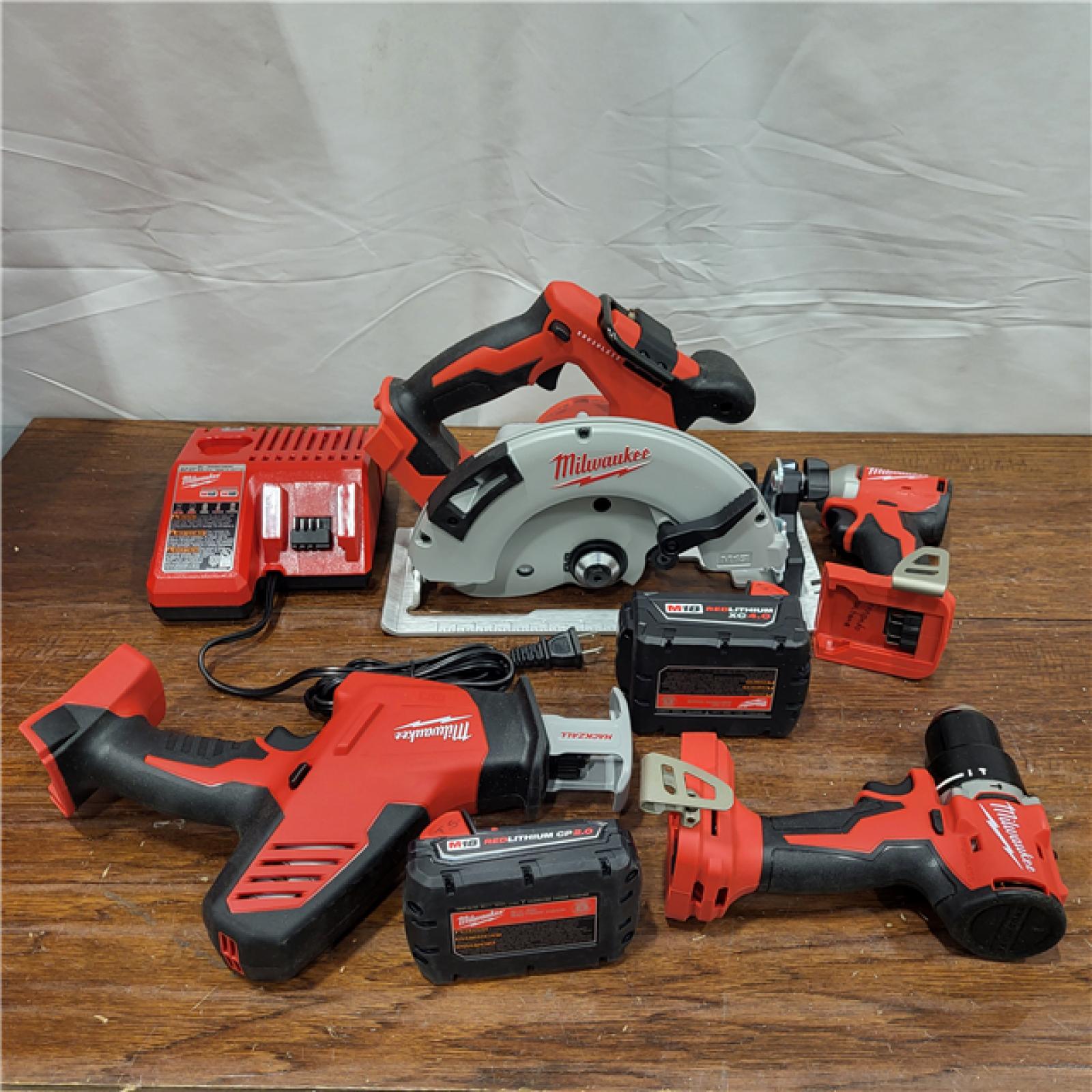 AS-IS Milwaukee M18 18-Volt Lithium-Ion Brushless Cordless Combo Kit (4-Tool) with 2-Batteries, 1-Charger and Tool Bag