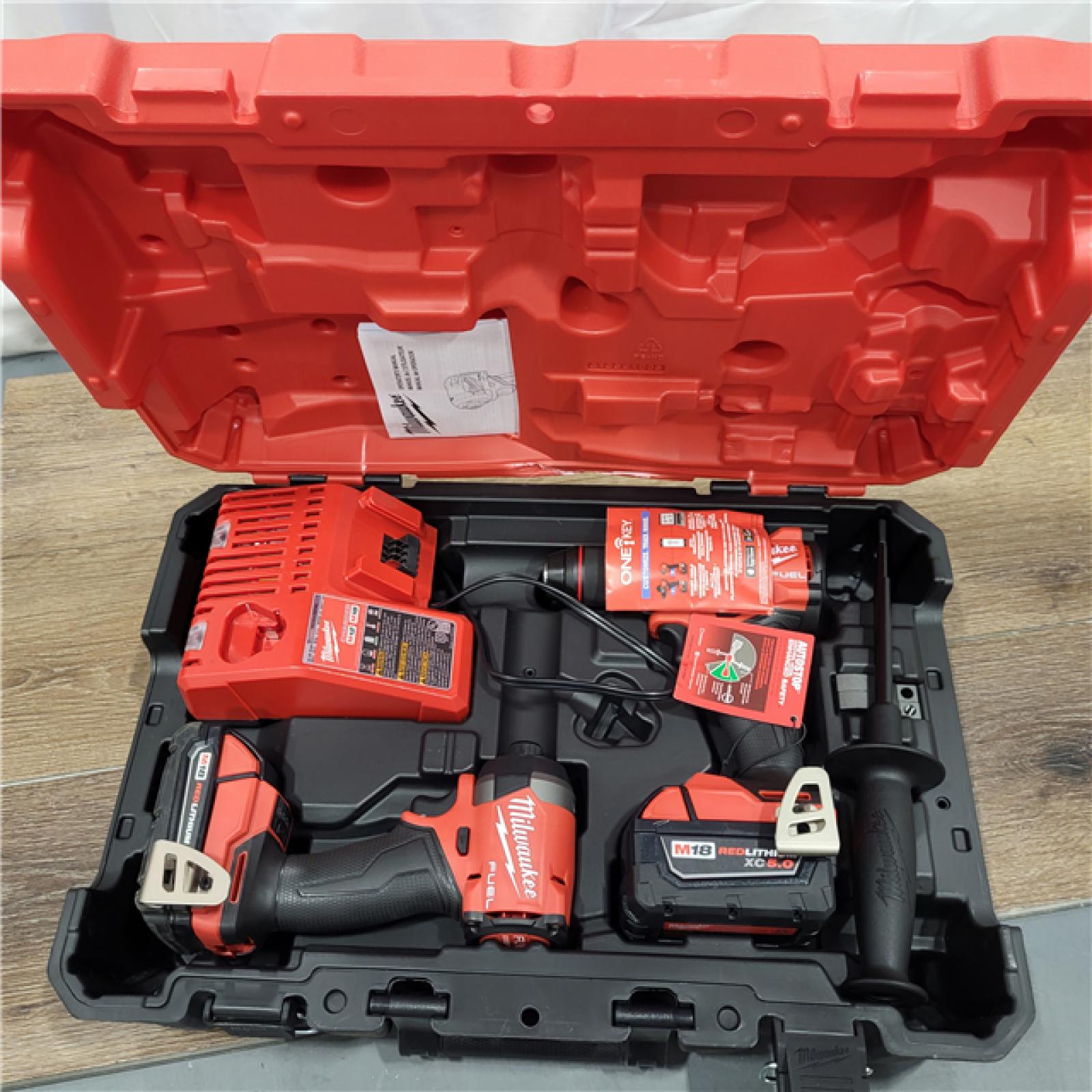 AS-IS Milwaukee M18 FUEL 18V Lithium-Ion Brushless Cordless Hammer Drill and Impact Driver Combo Kit (2-Tool) with 2 Batteries