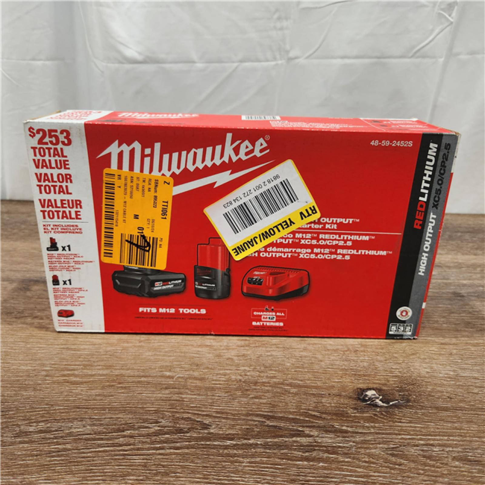 AS-IS Milwaukee M12 12-Volt Lithium-Ion High Output 5.0 Ah and 2.5 Ah Battery Packs and Charger Starter Kit (48-59-2452S)
