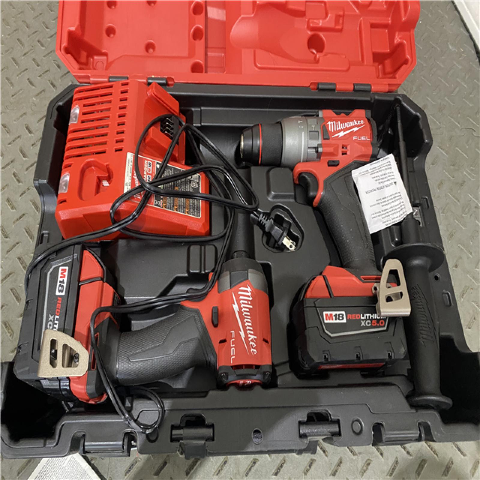 Houston location AS-IS Milwaukee 3697-22 M18 FUEL 1/2 Hammer Driller/Driver &1/4 Hex Impact Driver 2 Tool Combo Kit