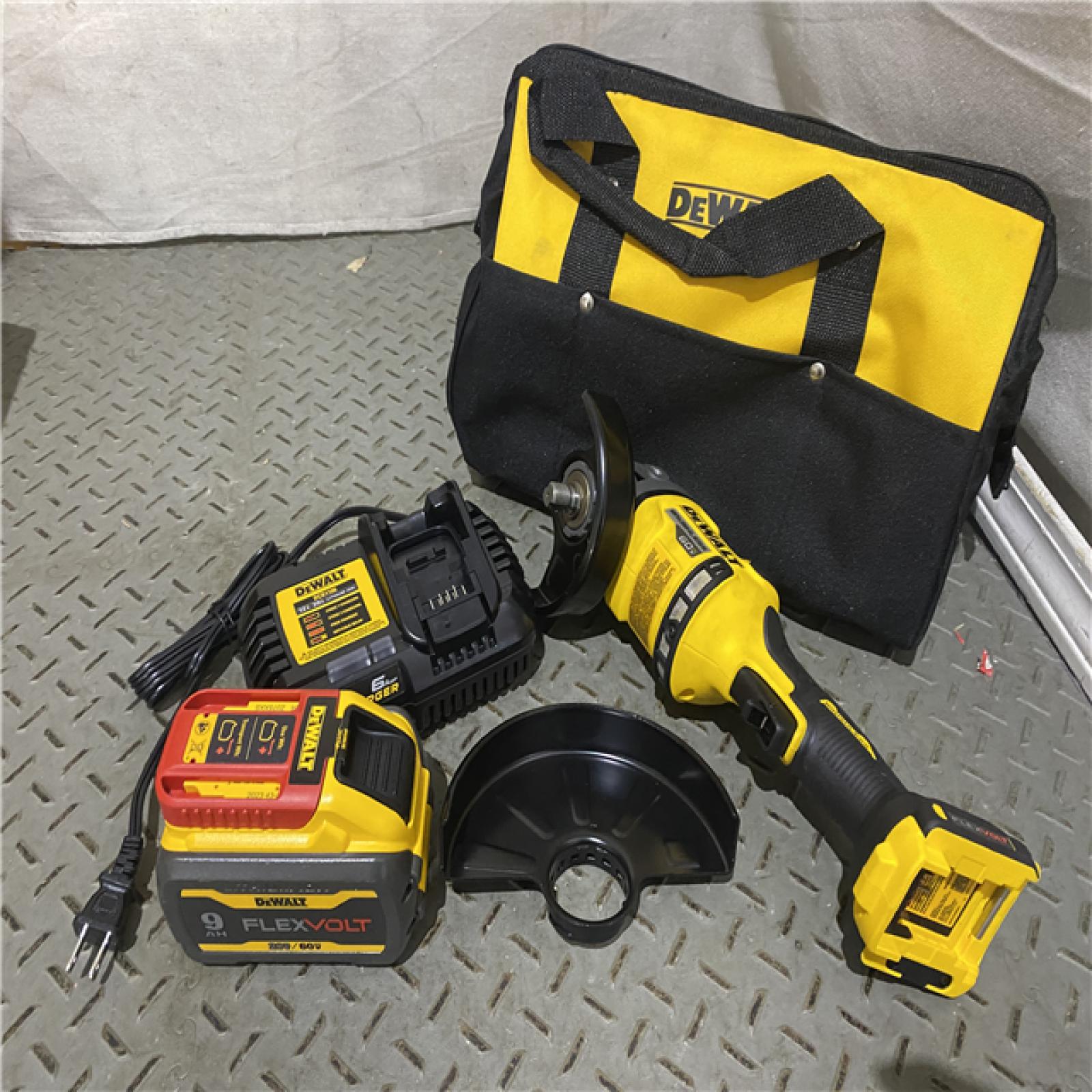 Houston location AS-IS DEWALT FLEXVOLT 60-Volt MAX Brushless 4-1/2 in. - 6 in. Cordless Grinder with Kickback Brake Kit (D)