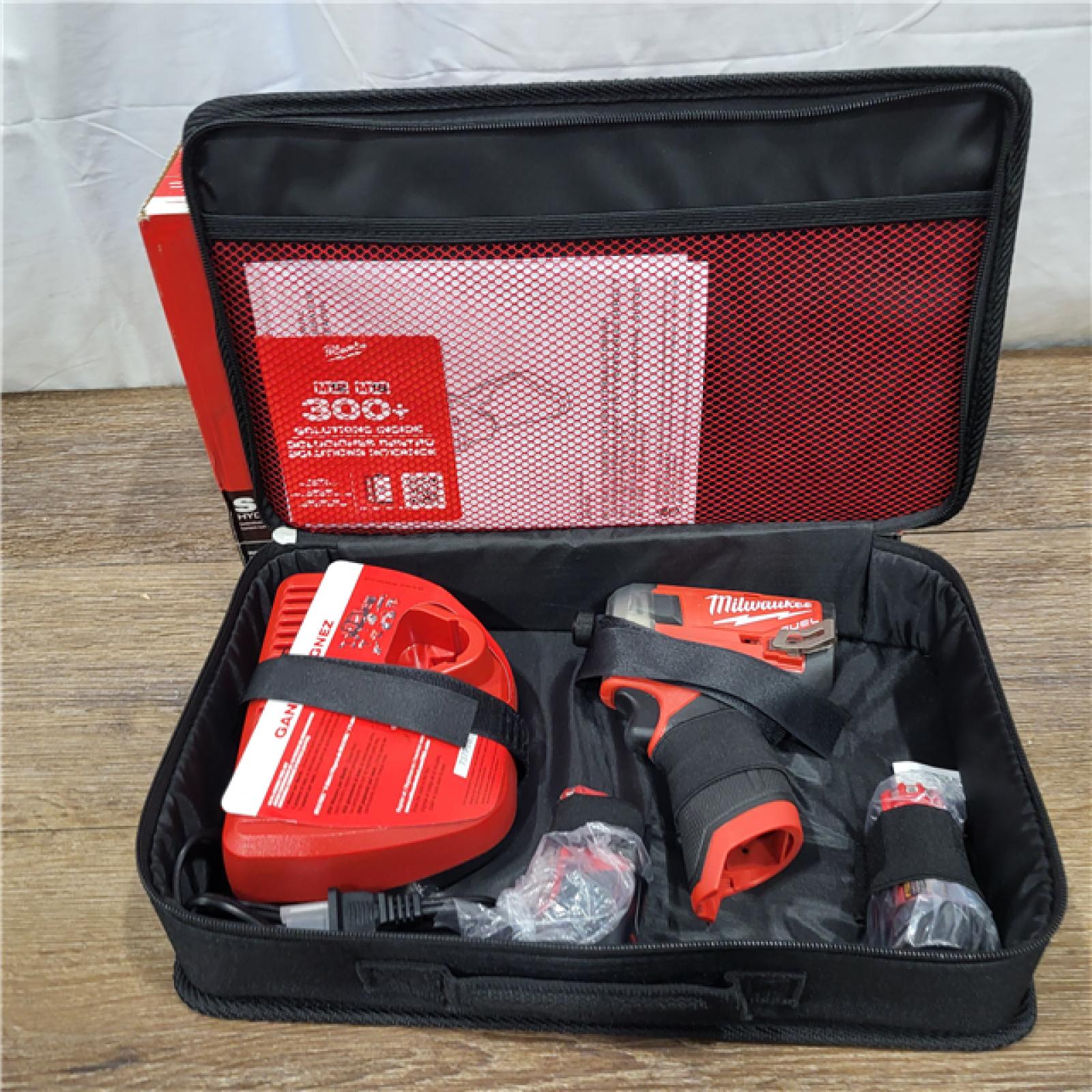 AS-IS M12 FUEL SURGE 12V Lithium-Ion Brushless Cordless 1/4 in. Hex Impact Driver Compact Kit W/Two 2.0Ah Batteries, Bag