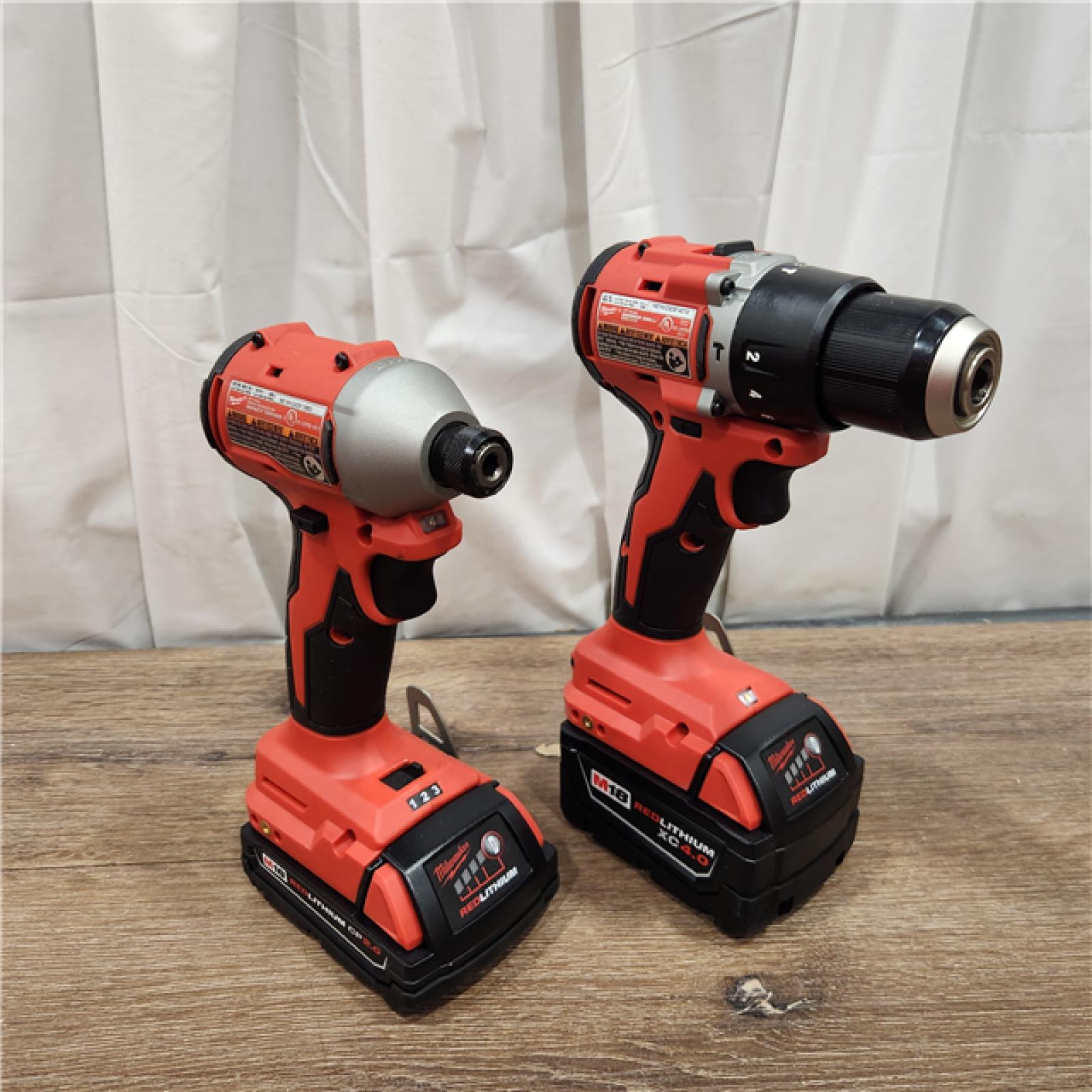 AS-IS M18 18-Volt Lithium-Ion Brushless Cordless Compact Hammer Drill/Impact Combo Kit (2-Tool) with (2) Batteries, Bag