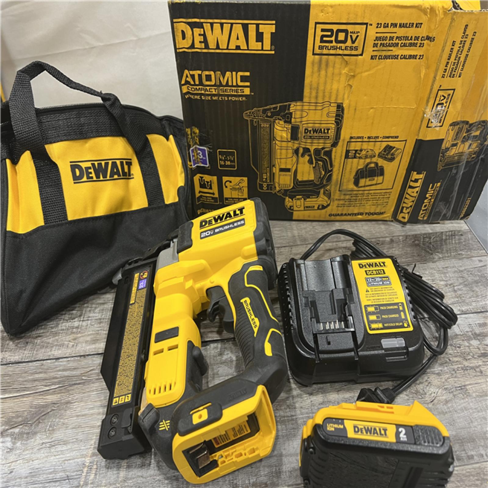 AS-IS DEWALT ATOMIC 20V MAX Lithium Ion Cordless 23 Gauge Pin Nailer Kit with 2.0Ah Battery and Charger