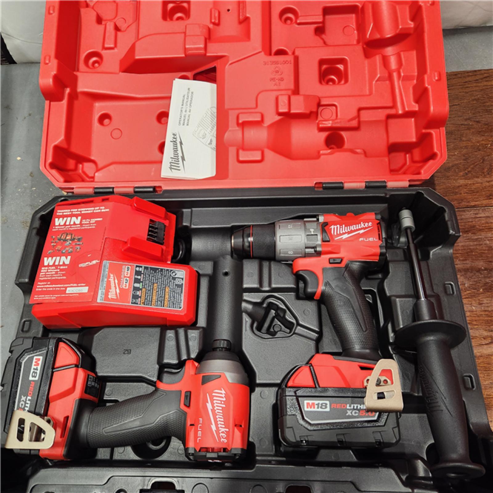 AS-IS Milwaukee M18â„¢ FUELâ„¢ 2-Tool Hammer Drill/Impact Driver Combo Kit - by International Tool