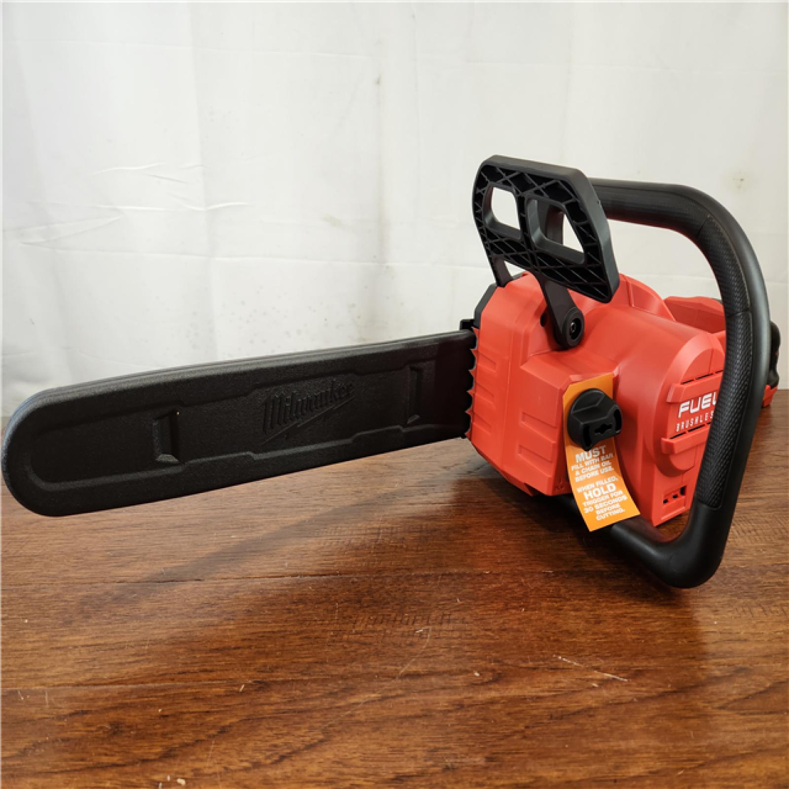 Like-New Milwaukee M18 FUEL 18V Brushless Cordless 16 in. Chainsaw Kit w/ M18 GEN II FUEL Blower