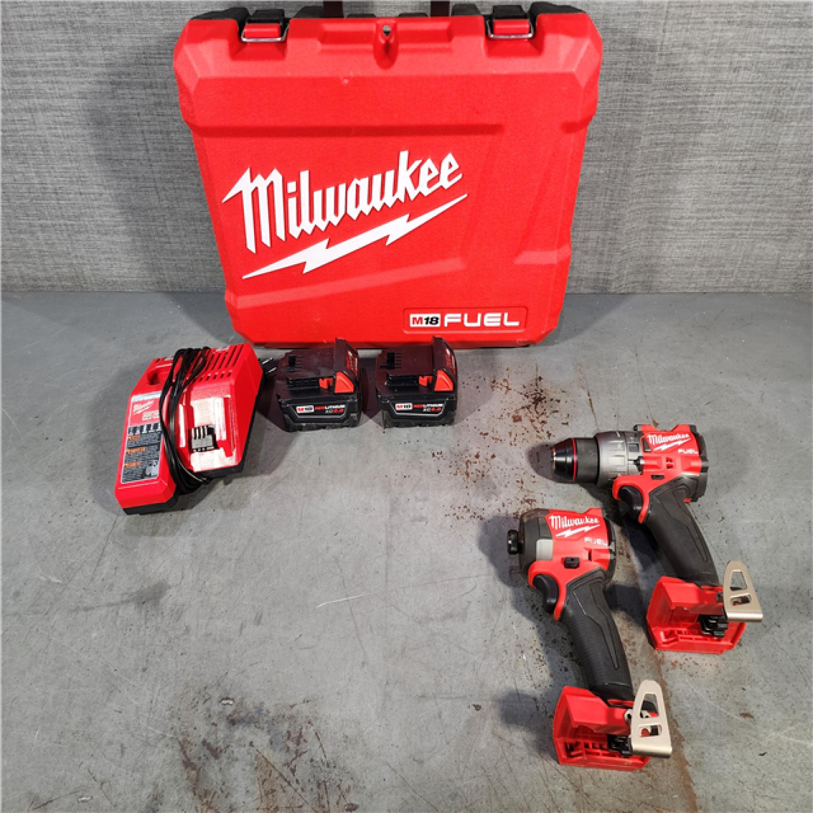 HOUSTON LOCATION - AS-IS Milwaukee M18 FUEL 18V Lithium-Ion Brushless Cordless Hammer Drill and Impact Driver Combo Kit (2-Tool) with 2 Batteries