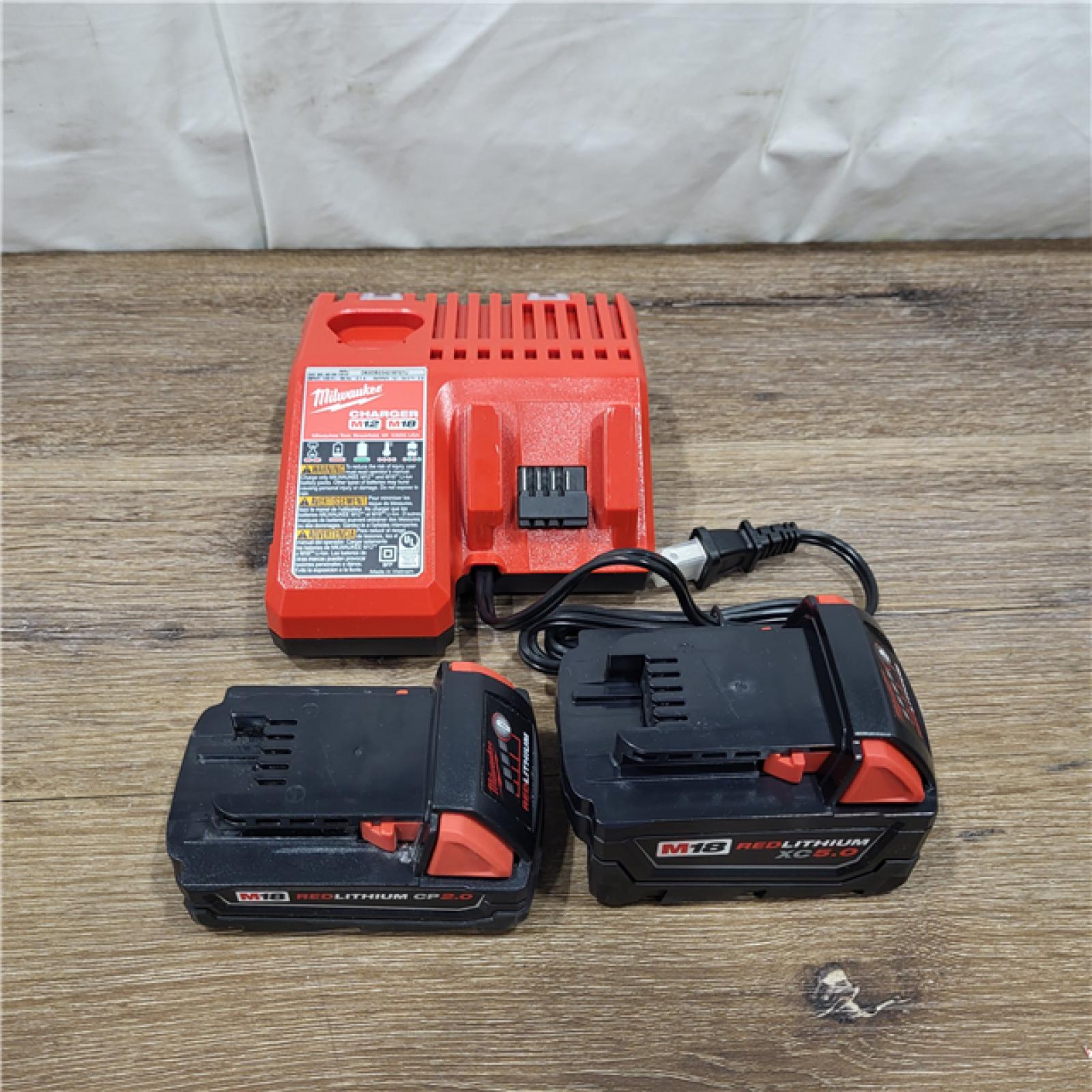 AS-IS Milwaukee M18 Redlithium Xc5.0 Resistant Battery Starter Kit