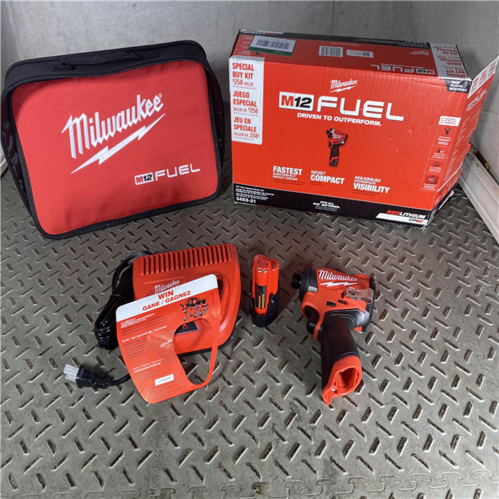 HOUSTON LOCATION - AS-IS Milwaukee 3453-21 M12 FUEL 12-Volt Lithium-Ion Brushless Cordless 1/4 in. Hex Impact Driver Compact Kit W 2.0Ah Battery and Bag